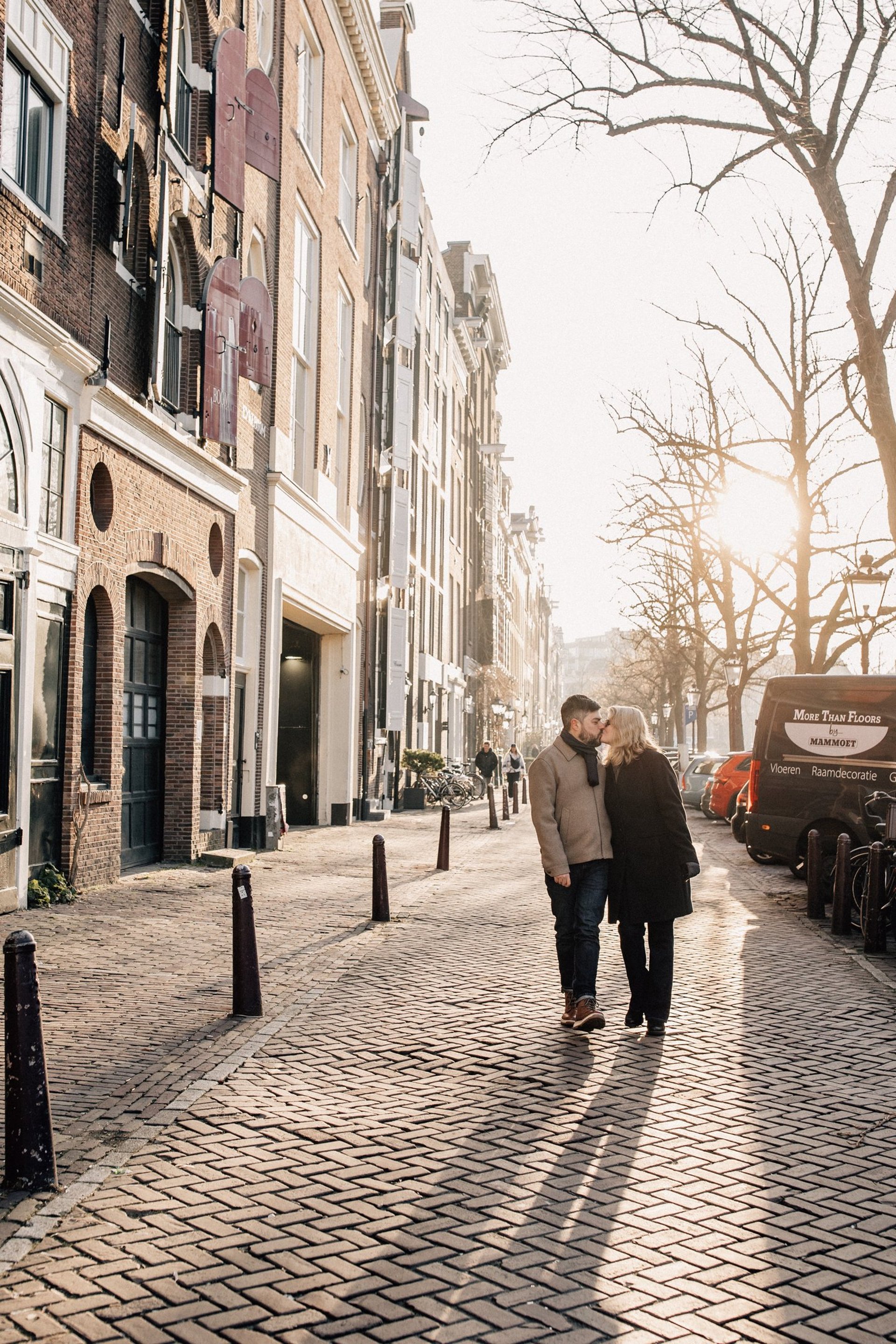 boats on dock near green trees during daytime
