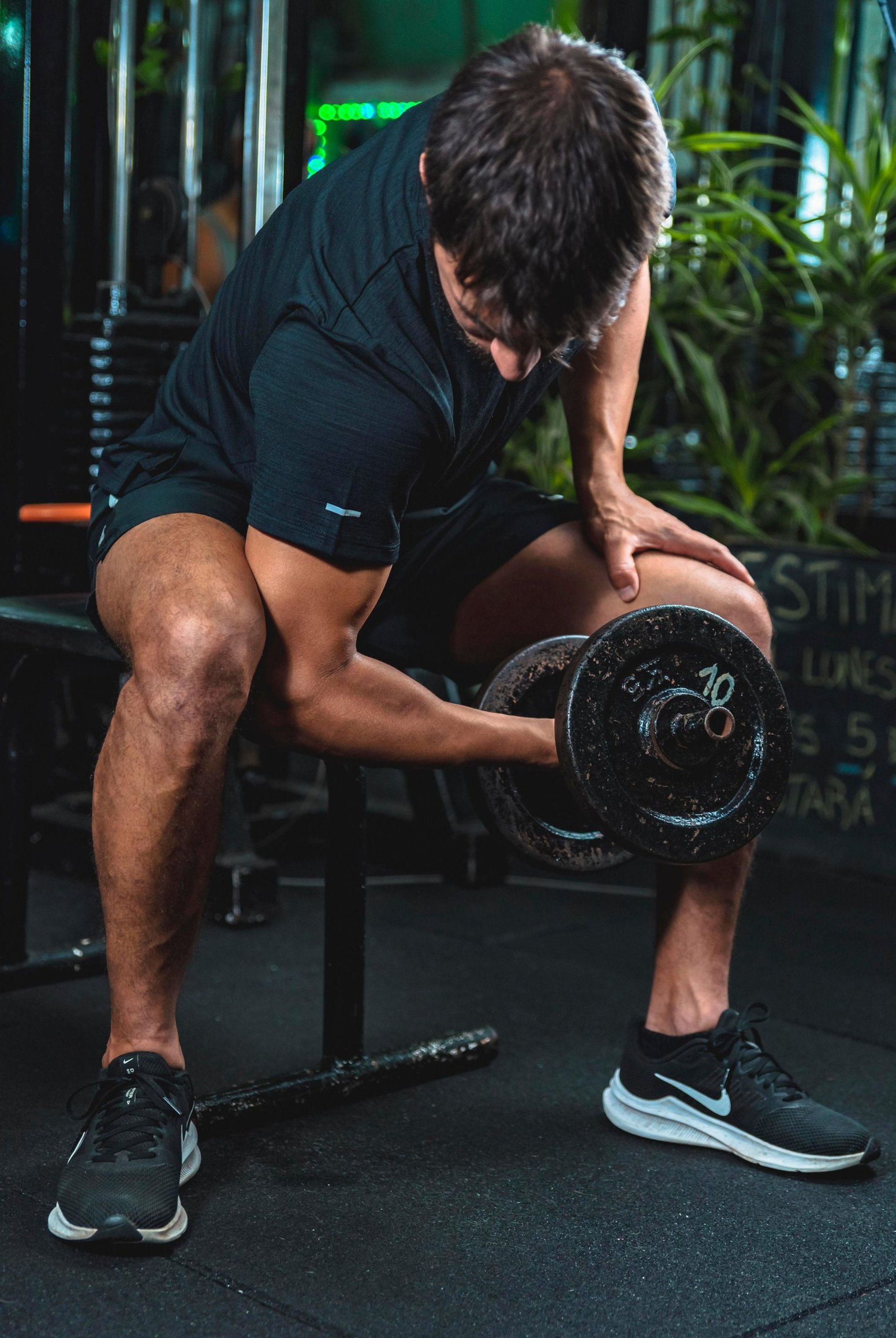 man in black tank top and black shorts