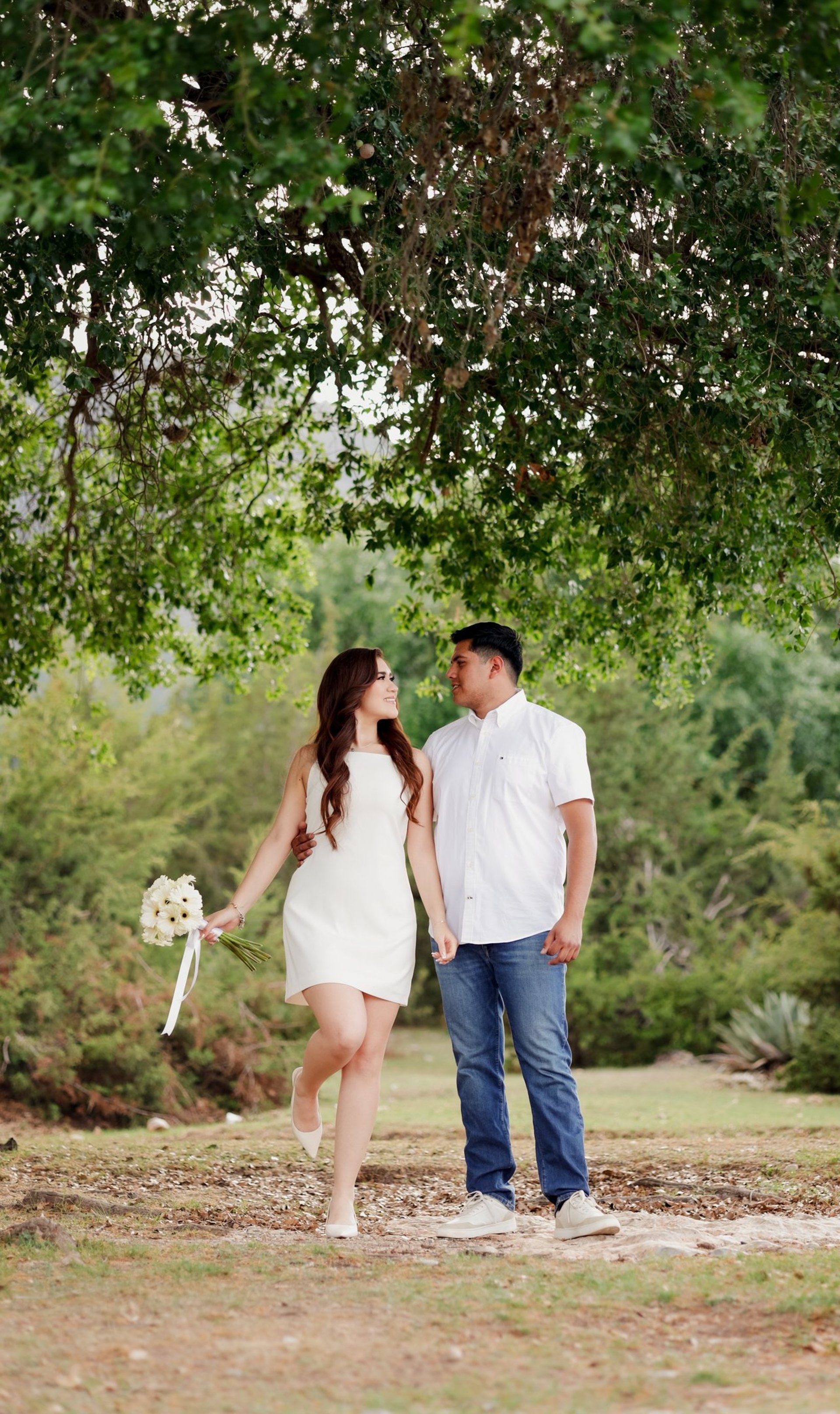 couple wearing silver-colored rings