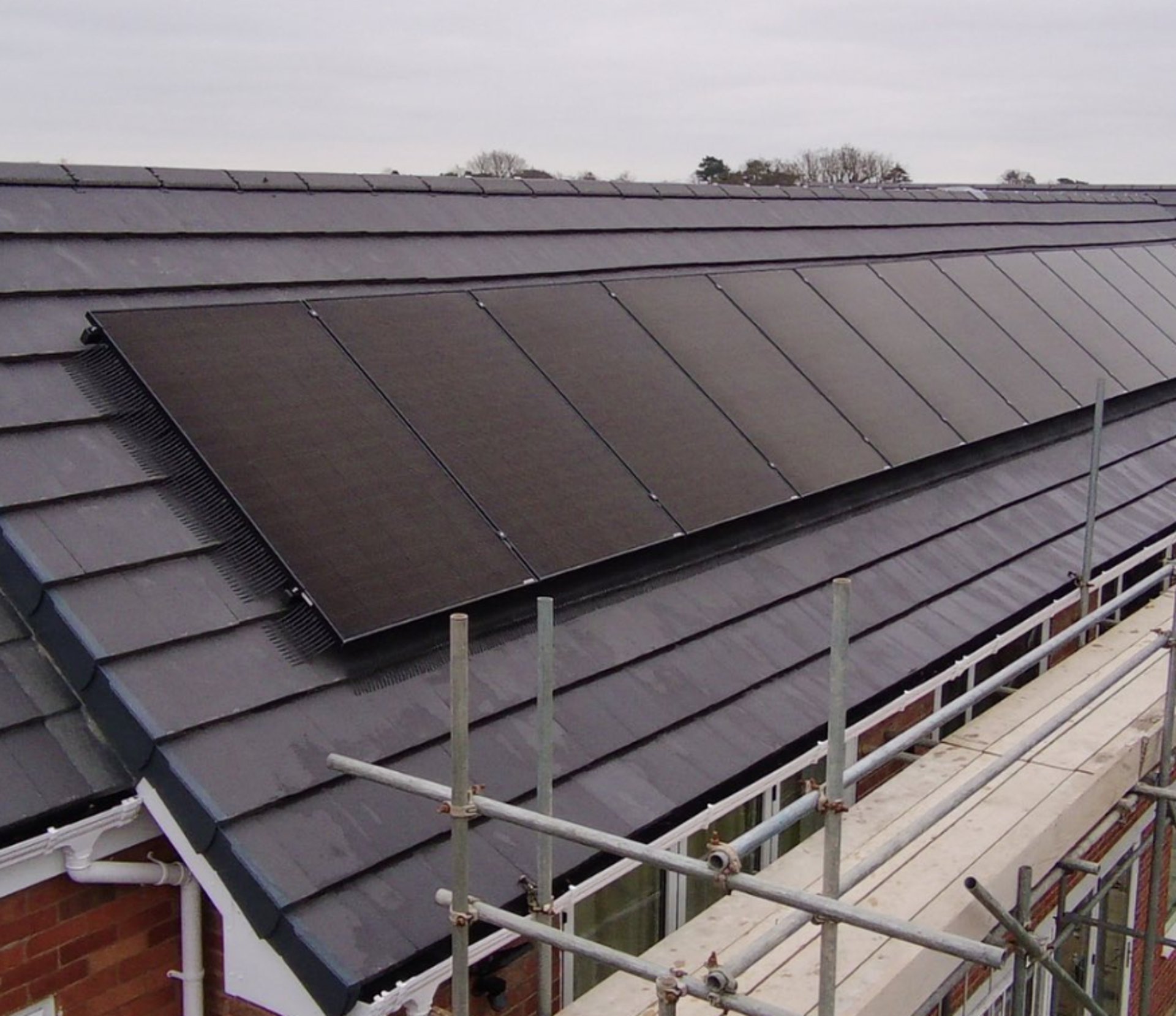 woman wearing yellow long-sleeved dress under white clouds and blue sky during daytime