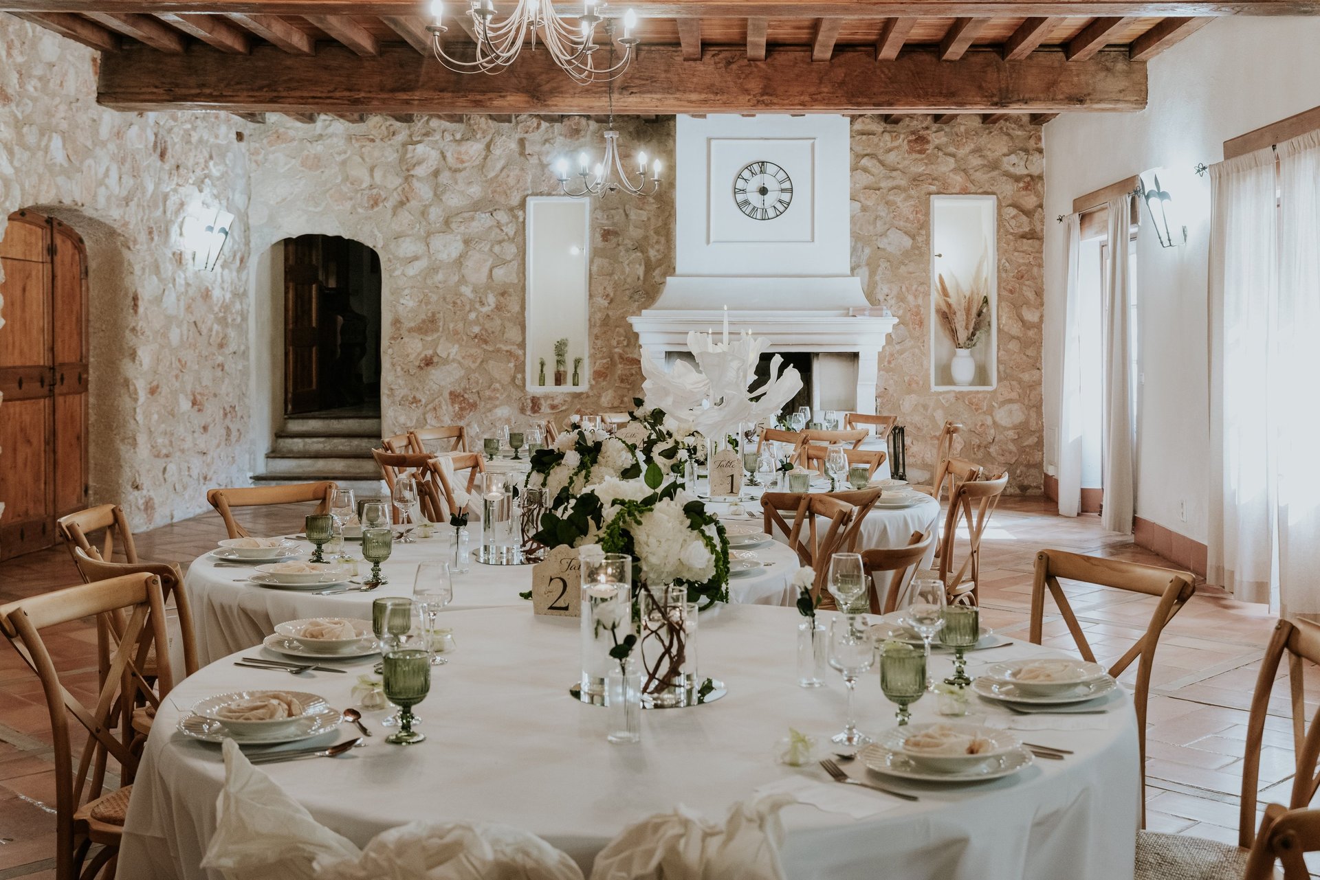 Outdoor table setting with lemons and floral arrangements