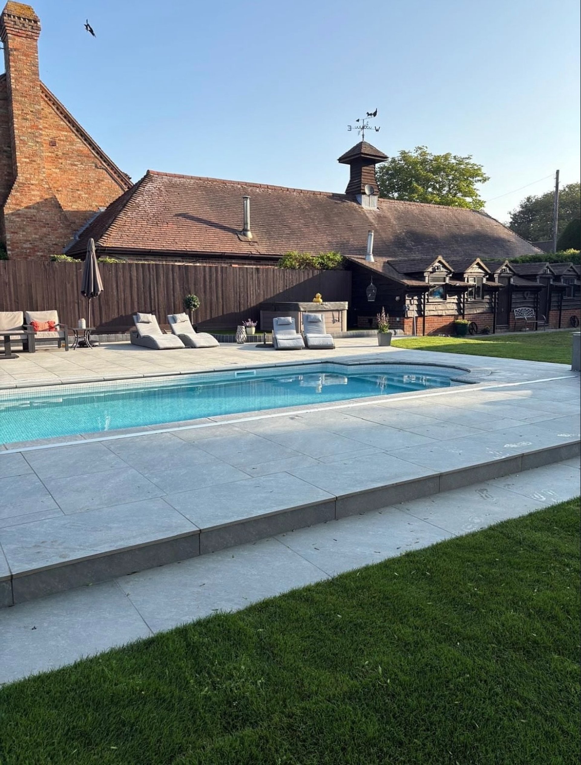 Herringbone pattern of weathered bricks on ground