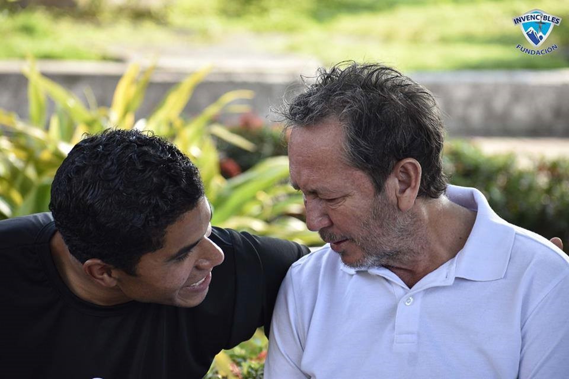 an abstract photo of a curved building with a blue sky in the background