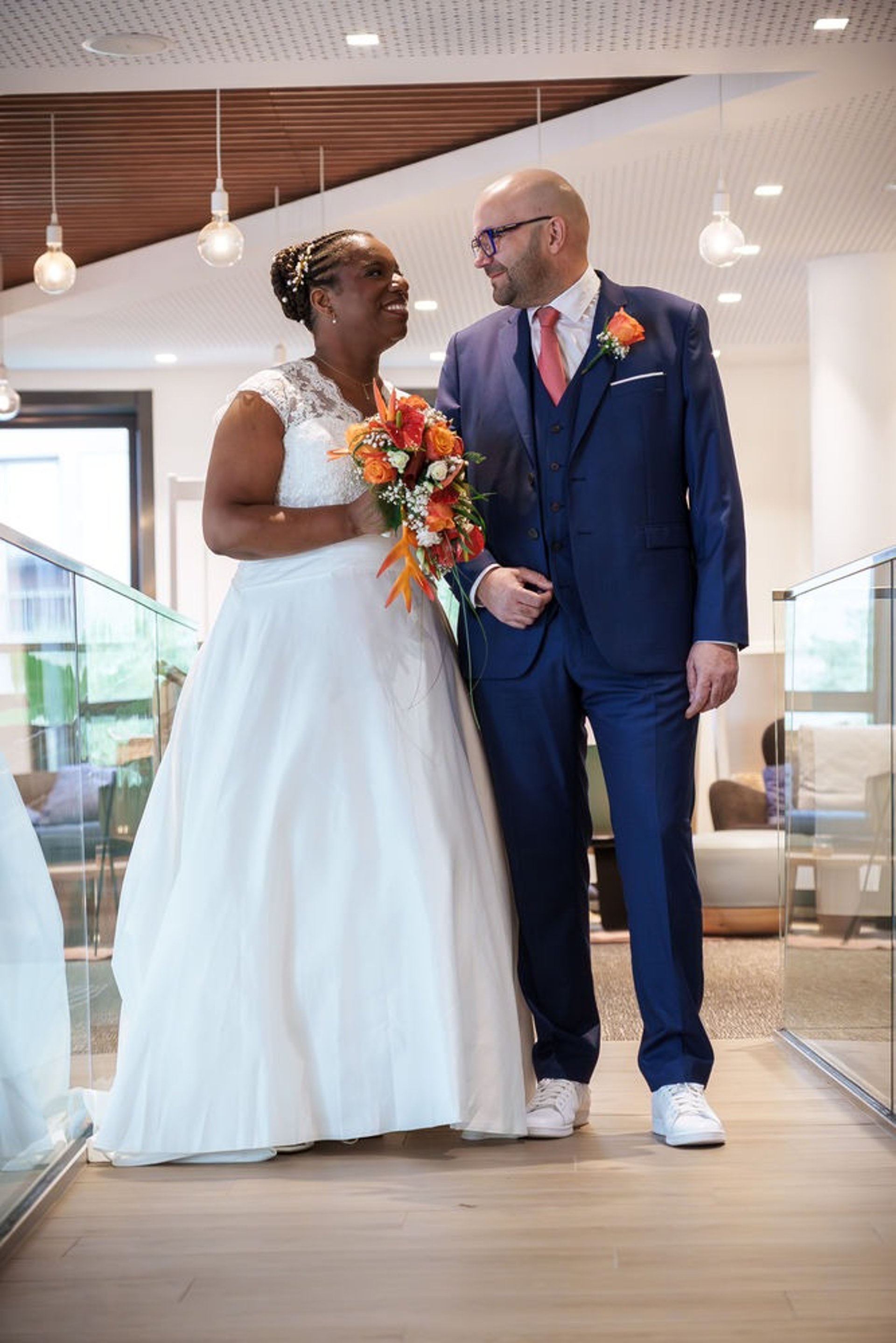 an abstract photo of a curved building with a blue sky in the background