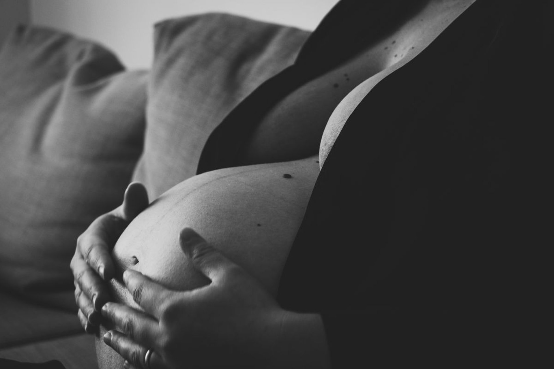 an abstract photo of a curved building with a blue sky in the background