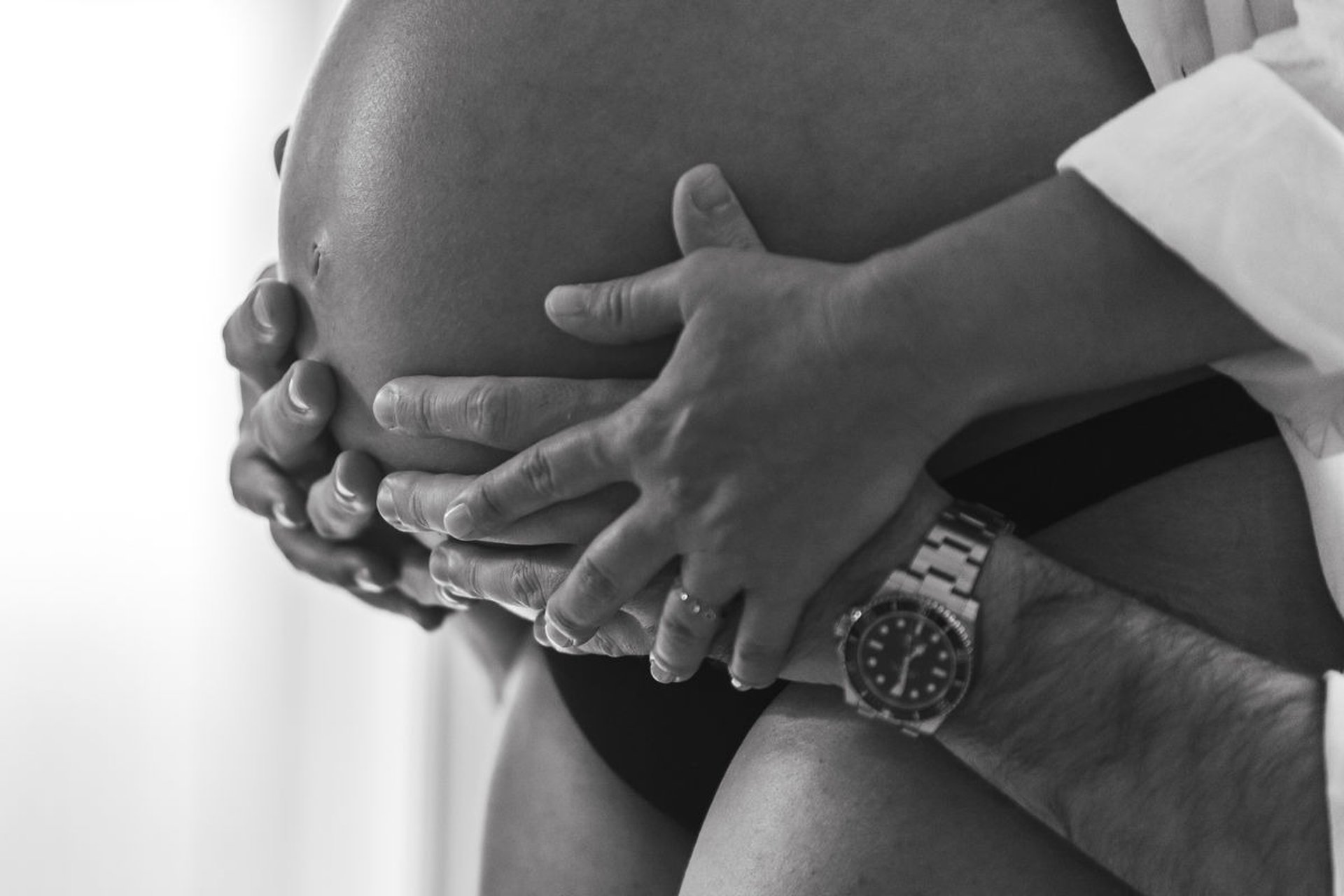 an abstract photo of a curved building with a blue sky in the background