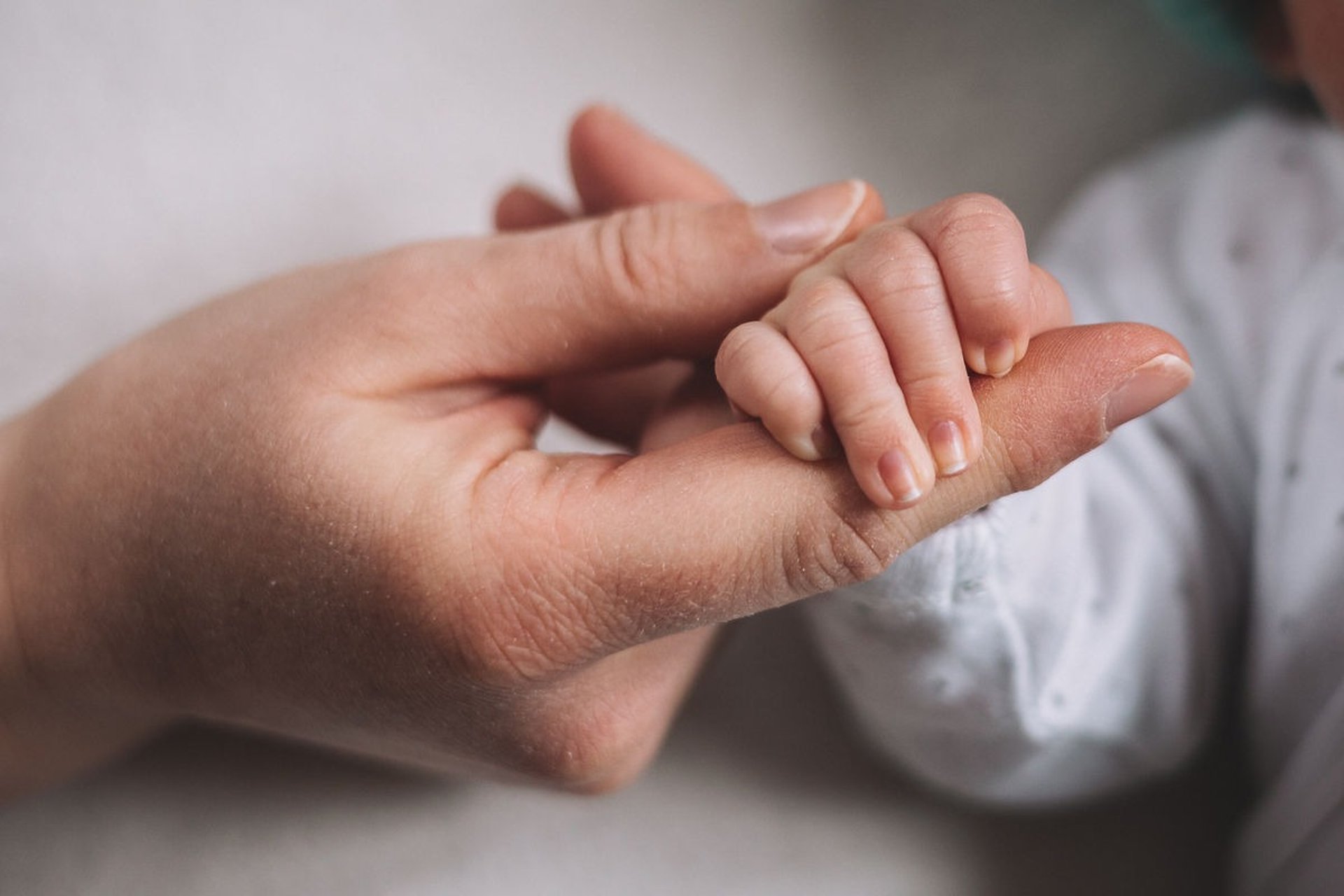 an abstract photo of a curved building with a blue sky in the background