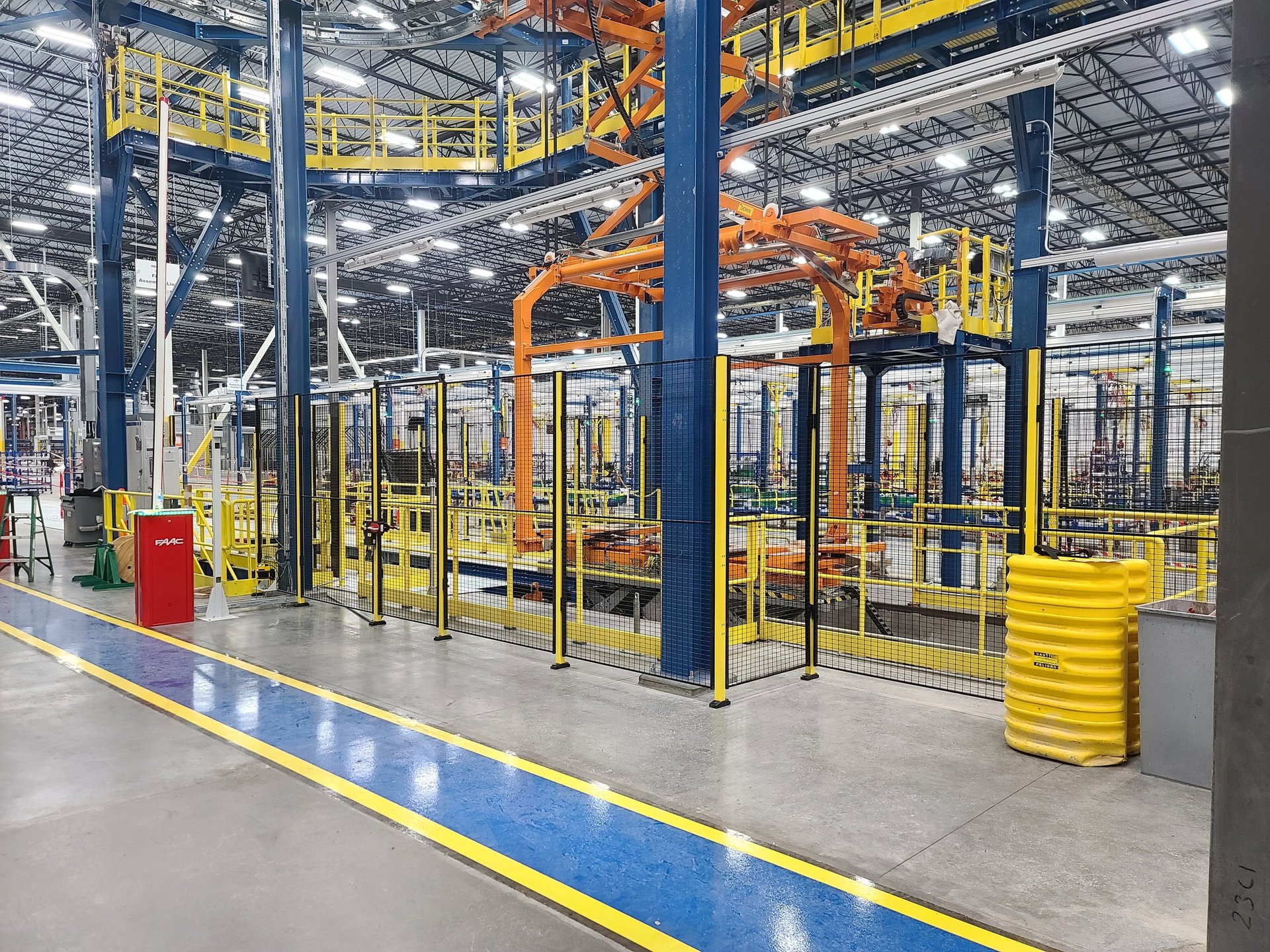 a factory filled with lots of orange machines