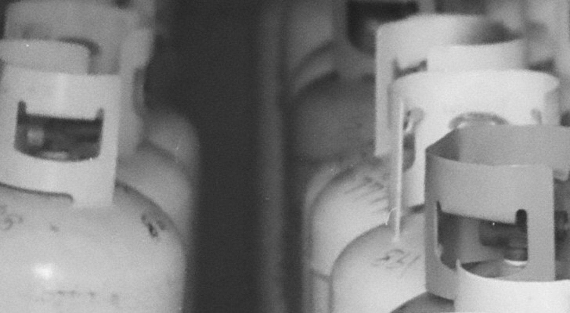 Rows of gas cylinders in a storage area.