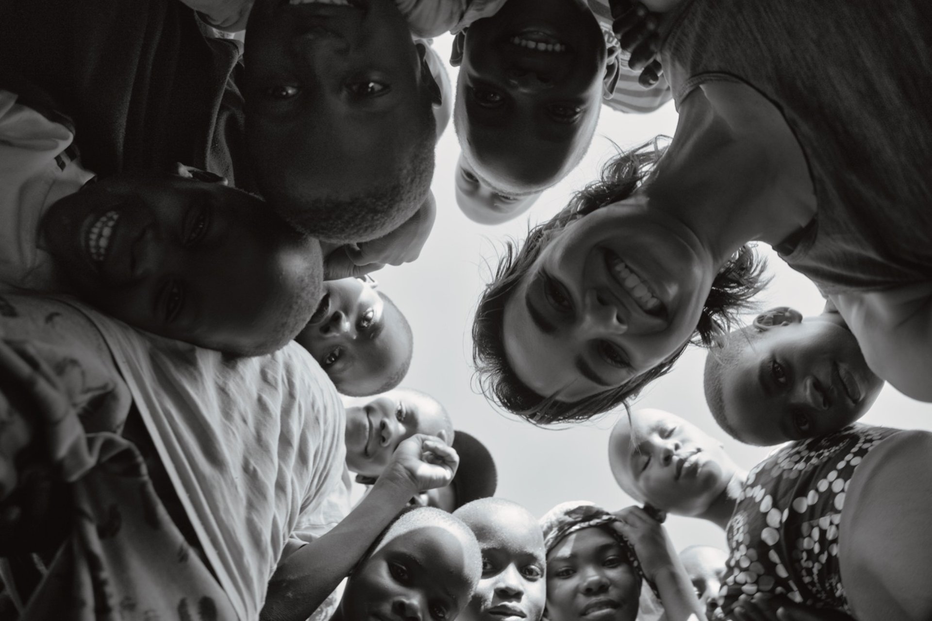 people with hands gathered in the middle