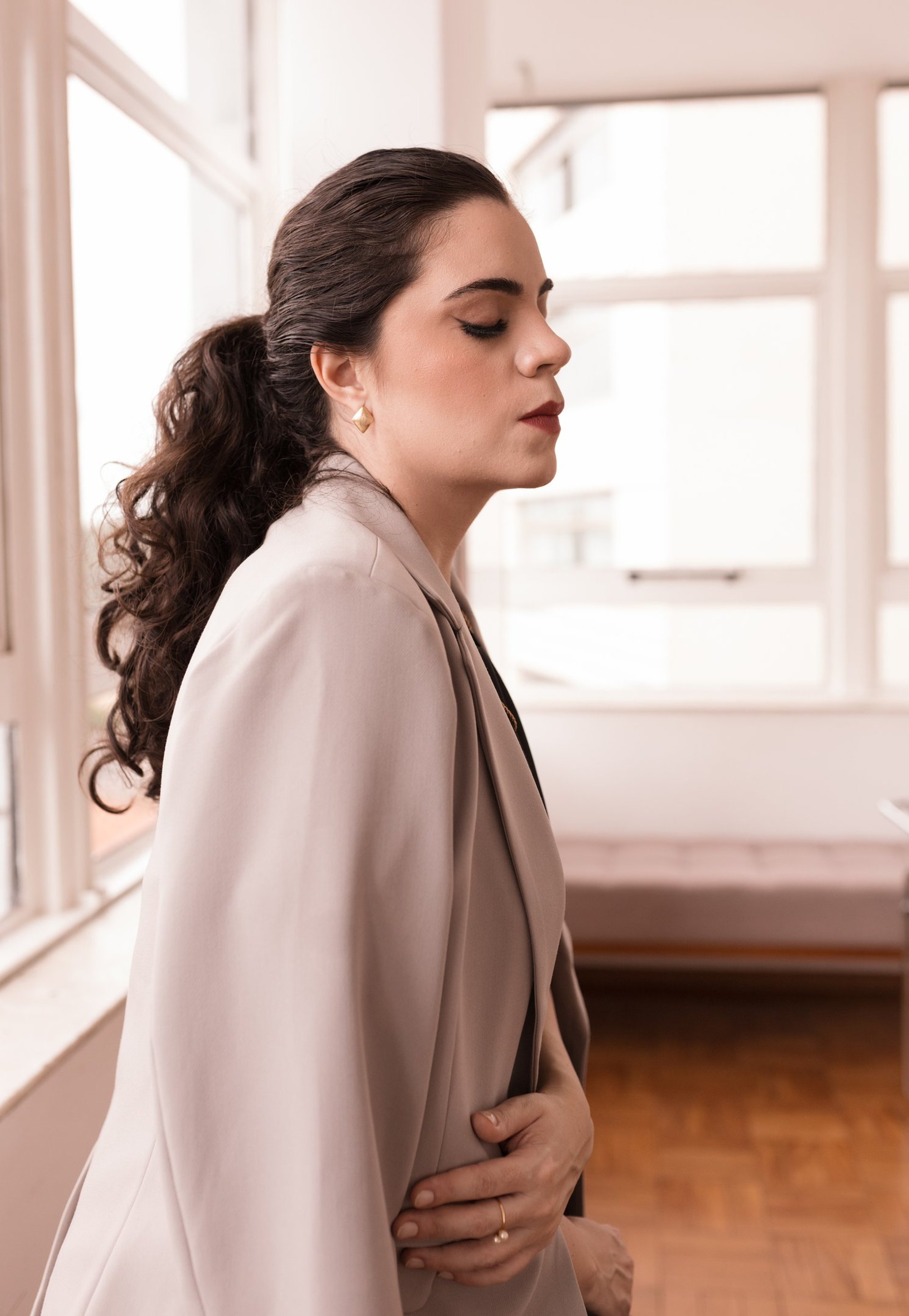 woman wearing yellow long-sleeved dress under white clouds and blue sky during daytime