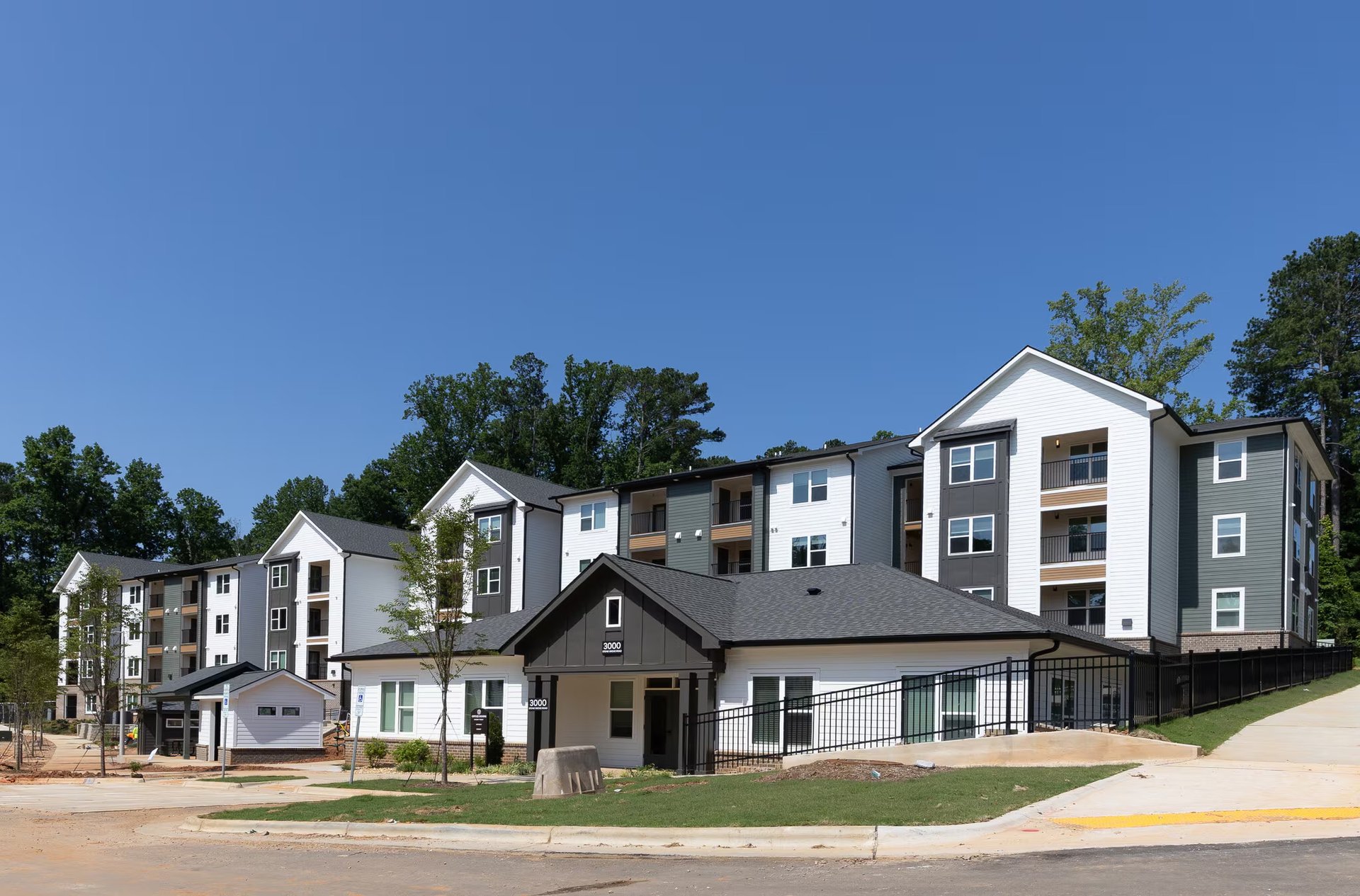 Exterior view of new construction affordable housing buildings at Pines at Peach Rd in Raleigh, NC