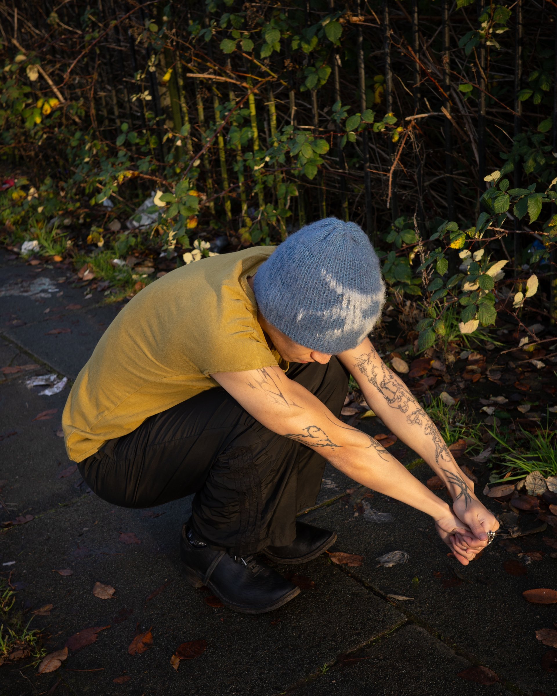 person wearing grey knit sweater