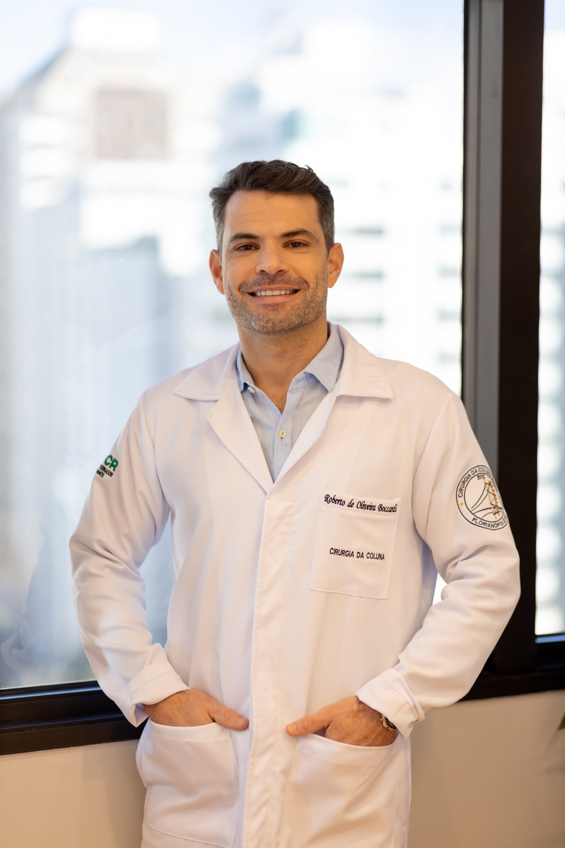 A group of doctors standing around a hospital bed