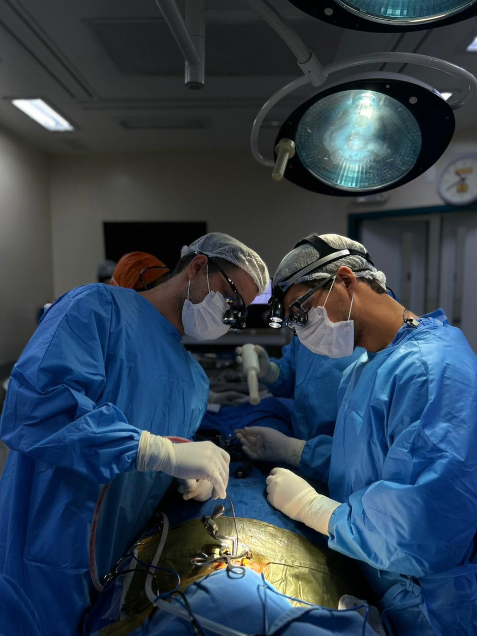 a group of doctors performing surgery on a patient