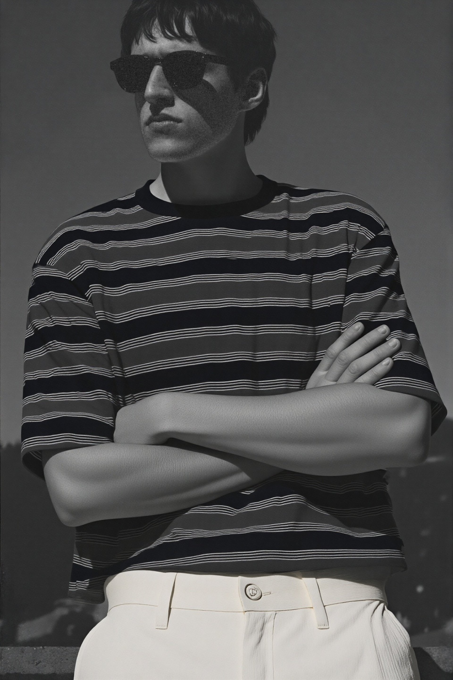 an abstract photo of a curved building with a blue sky in the background