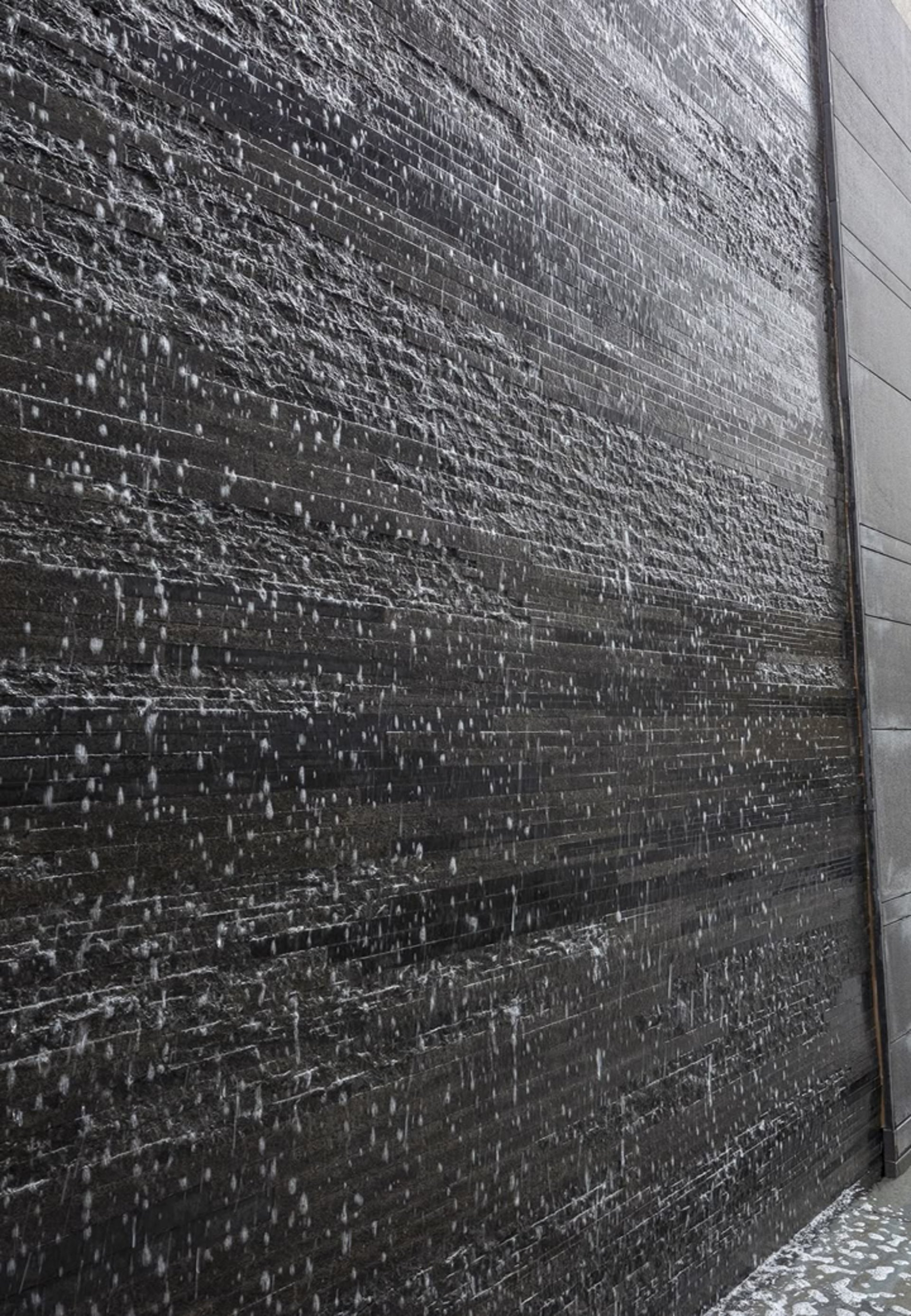 an abstract photo of a curved building with a blue sky in the background