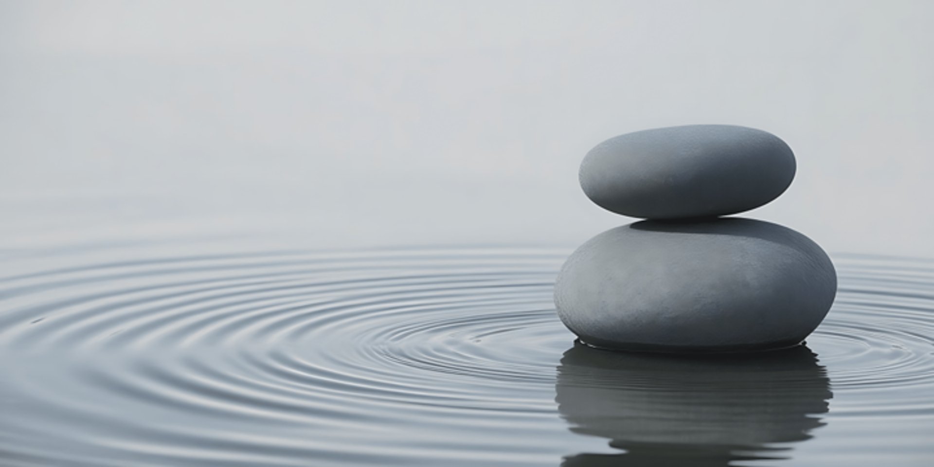 an abstract photo of a curved building with a blue sky in the background