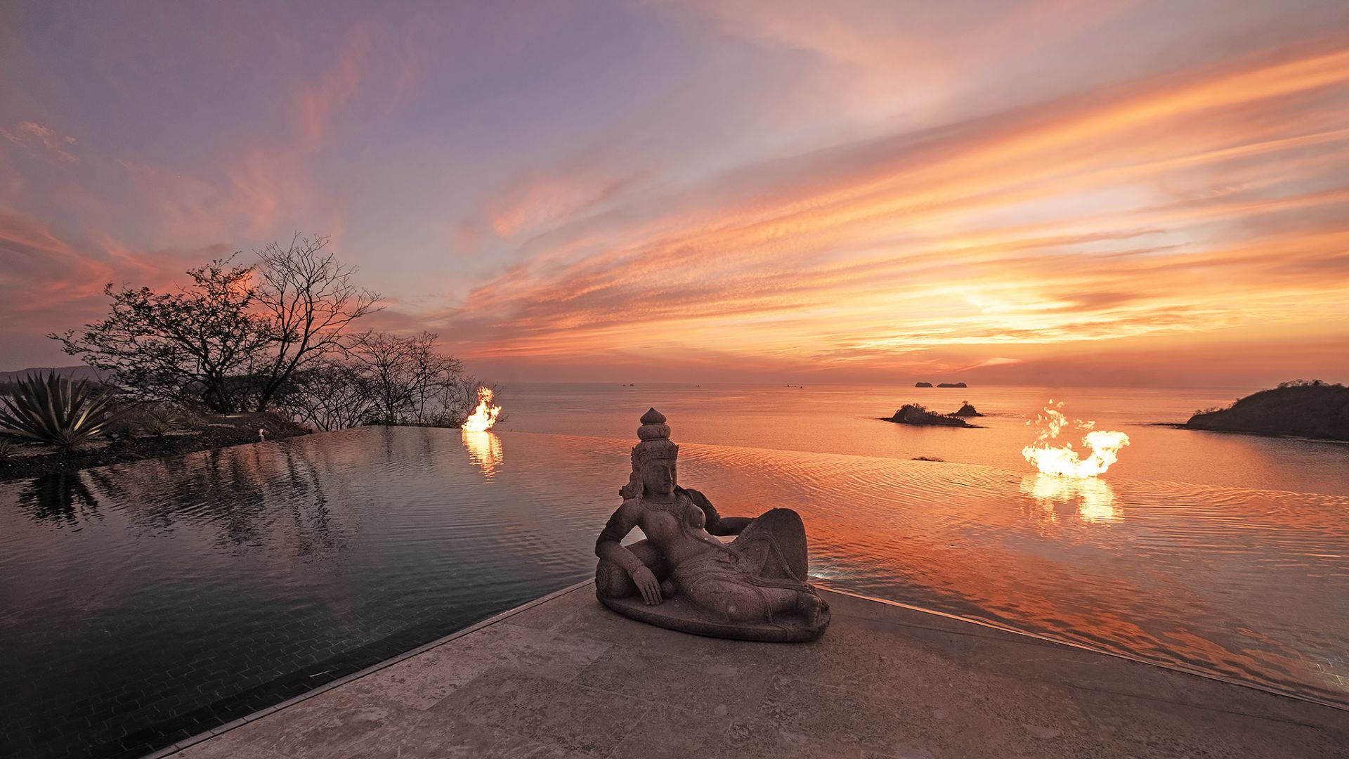 an abstract photo of a curved building with a blue sky in the background