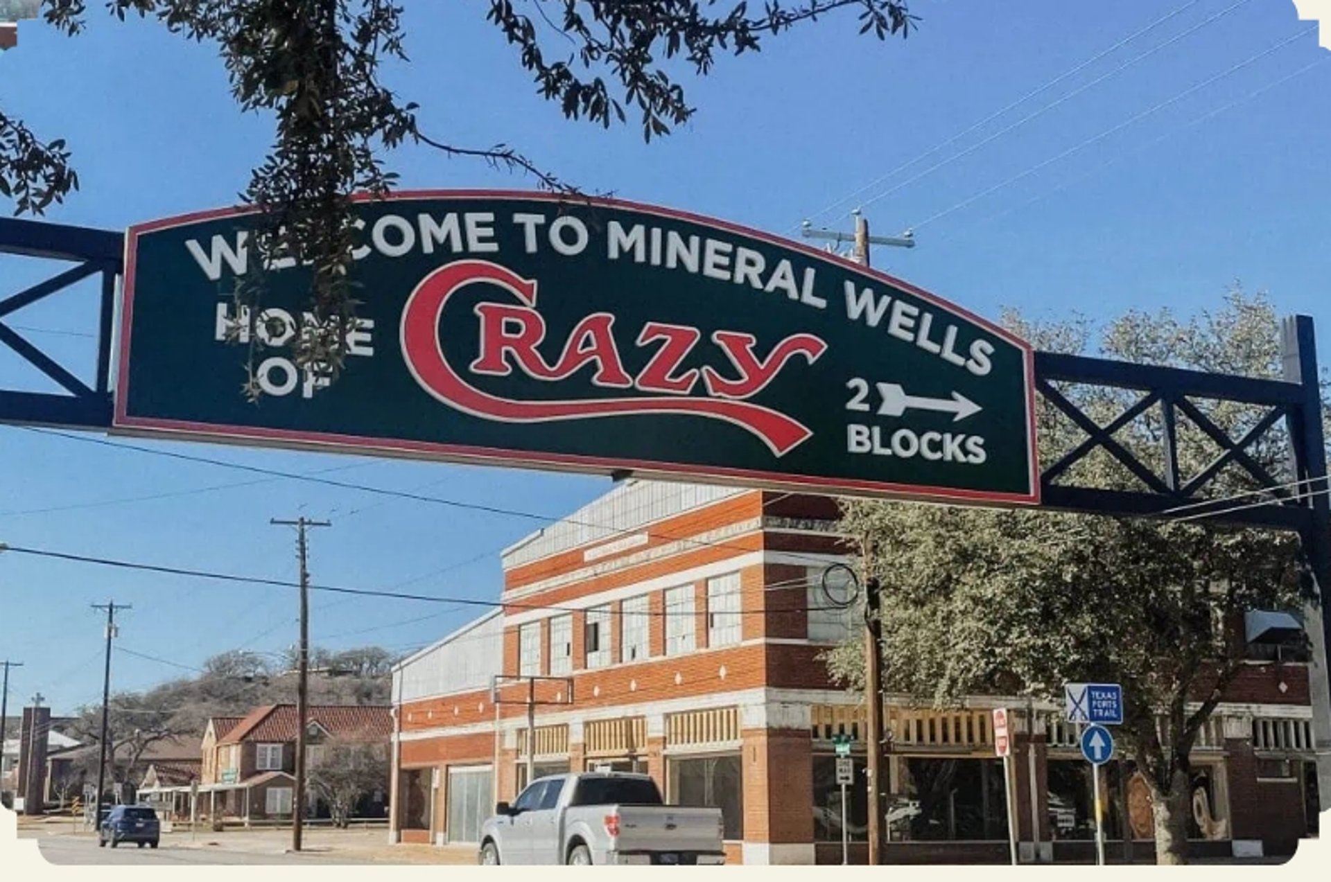 an abstract photo of a curved building with a blue sky in the background