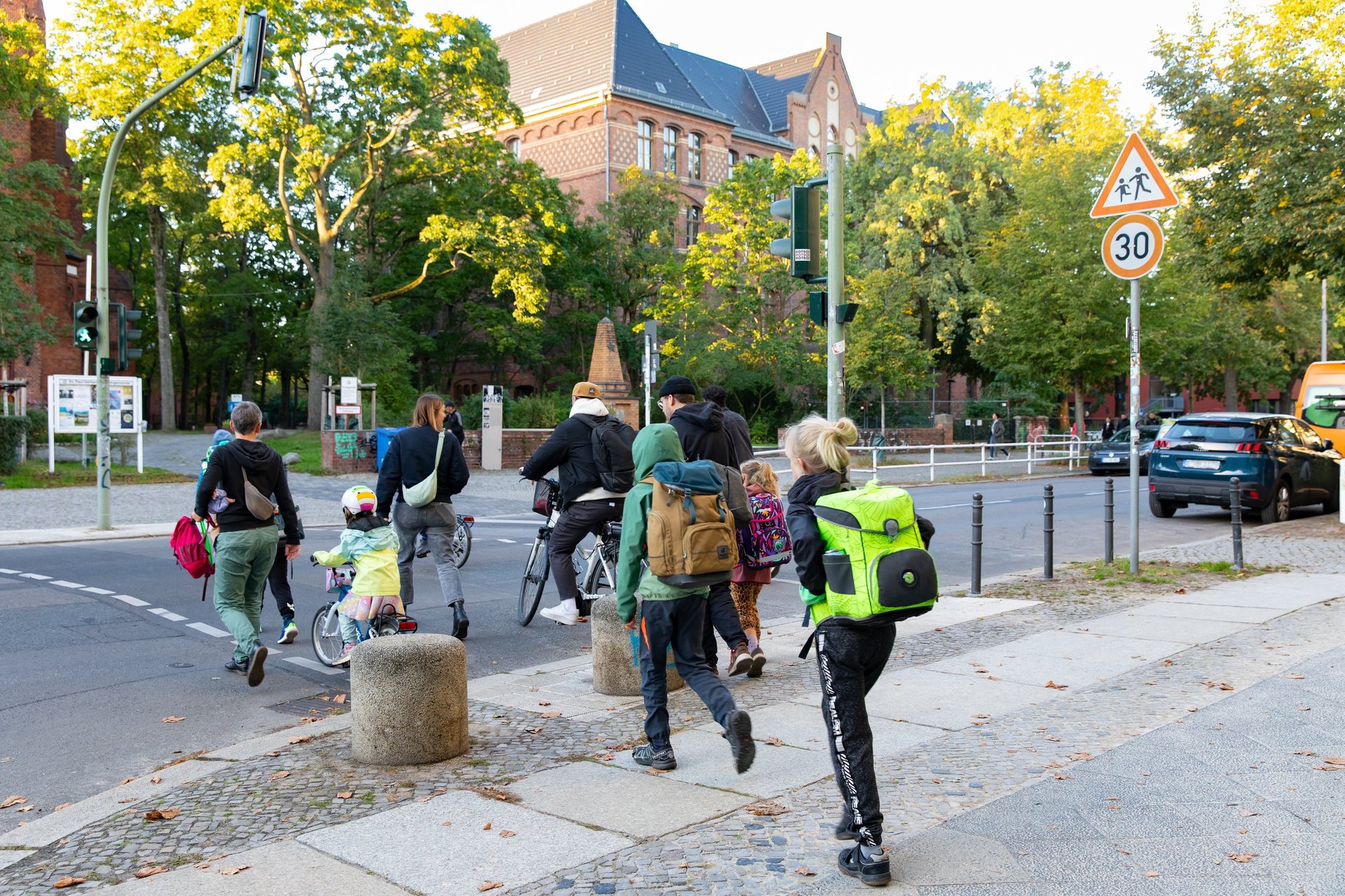 people walking on gray concrete road during daytime