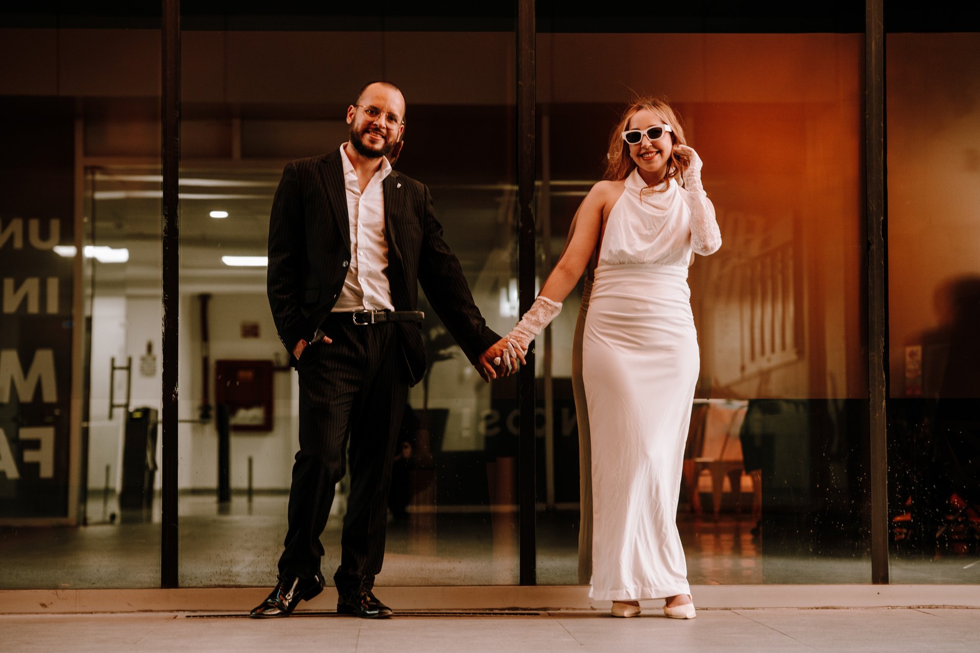 an abstract photo of a curved building with a blue sky in the background