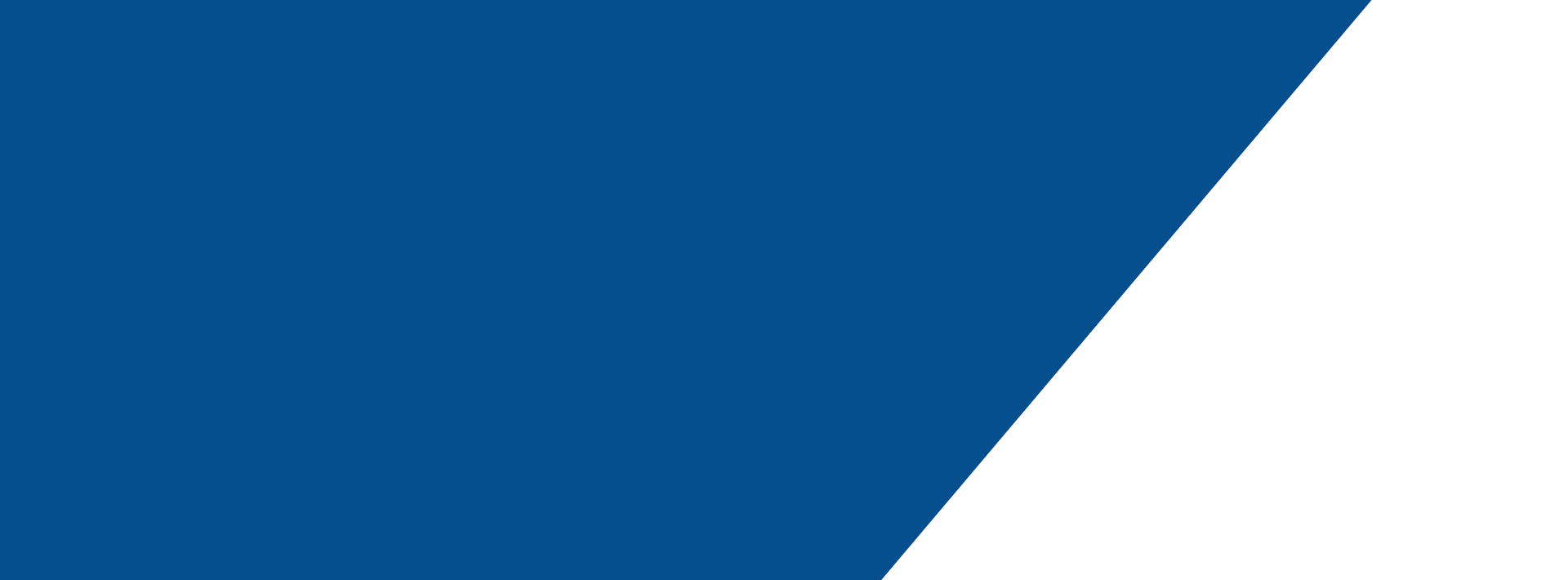 a very tall building with a very cloudy sky in the background