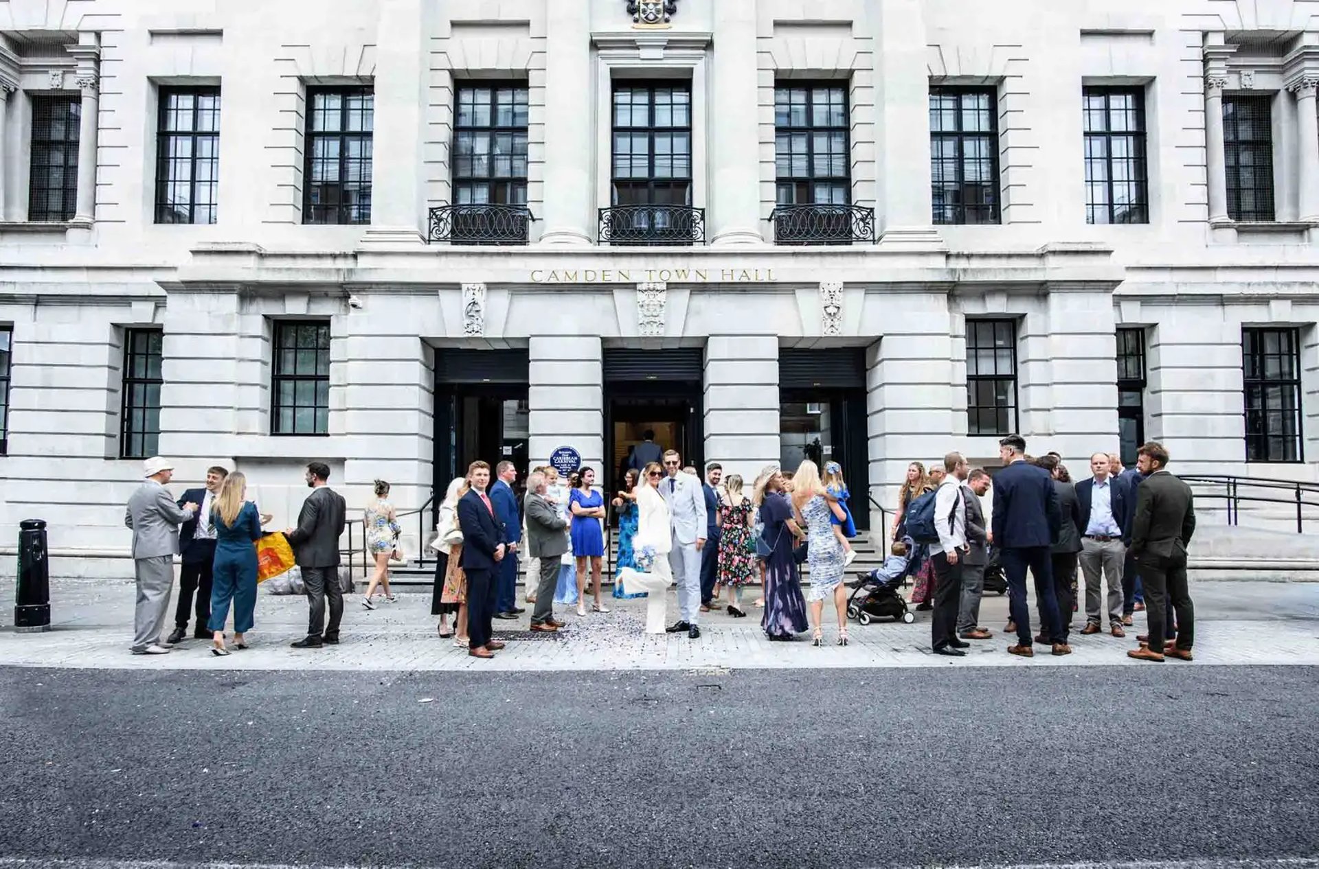 wedding party standing outside Camden Town Hall
