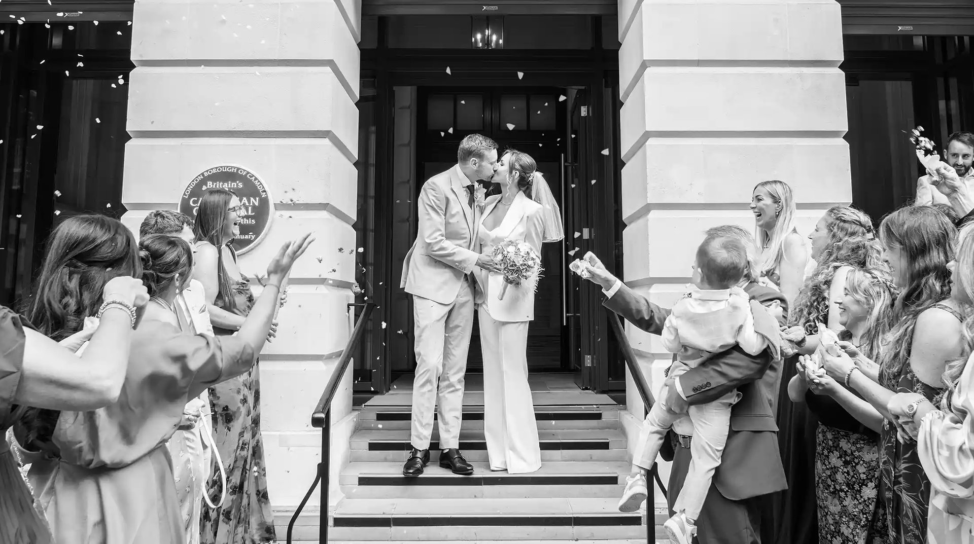 newly-weds celebrating on the steps of Camden Town Hall