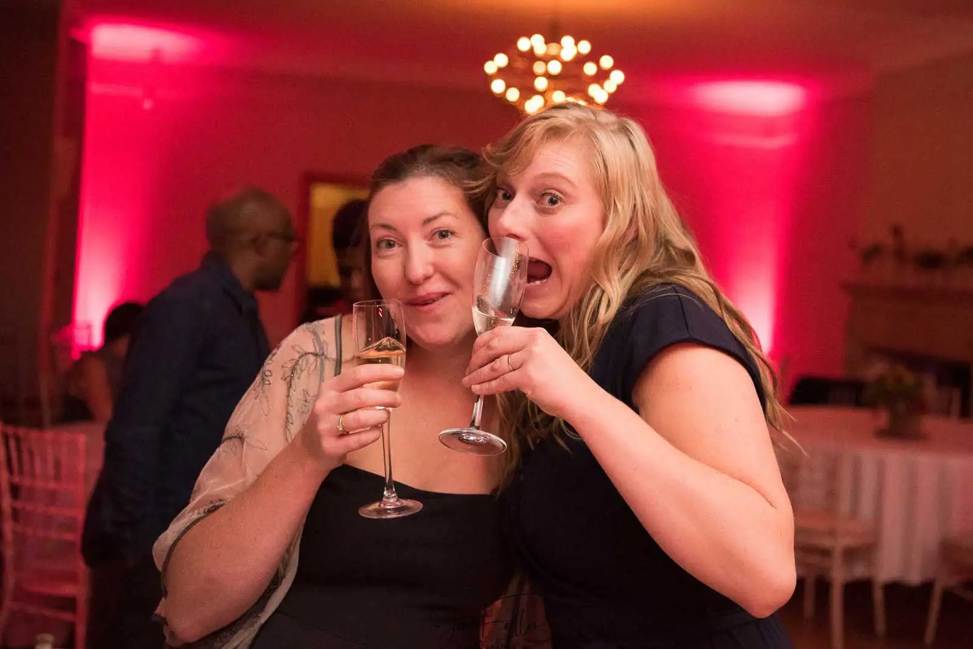 same-sex couple enjoying speeches after their wedding at The Trafalgar Tavern Greenwich