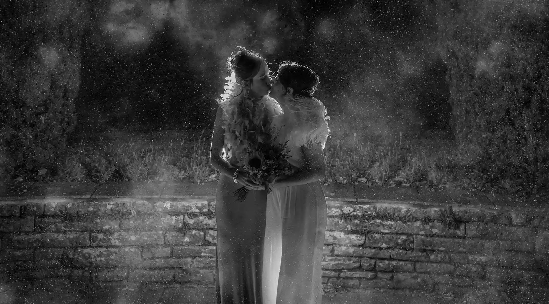 Sue and Toni share a kiss in the grounds of Coombe Lodge Bristol