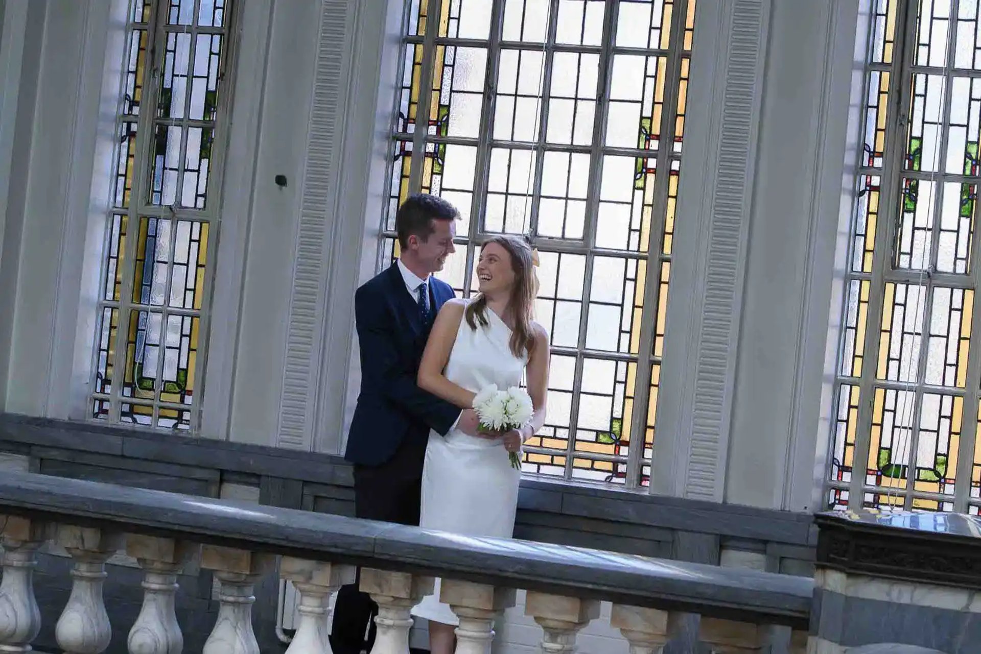bride and groom standing inside Islington Town Hall