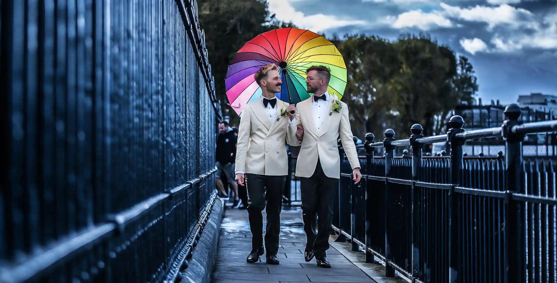 Newly-weds walking alongside the River Thames in Greenwich