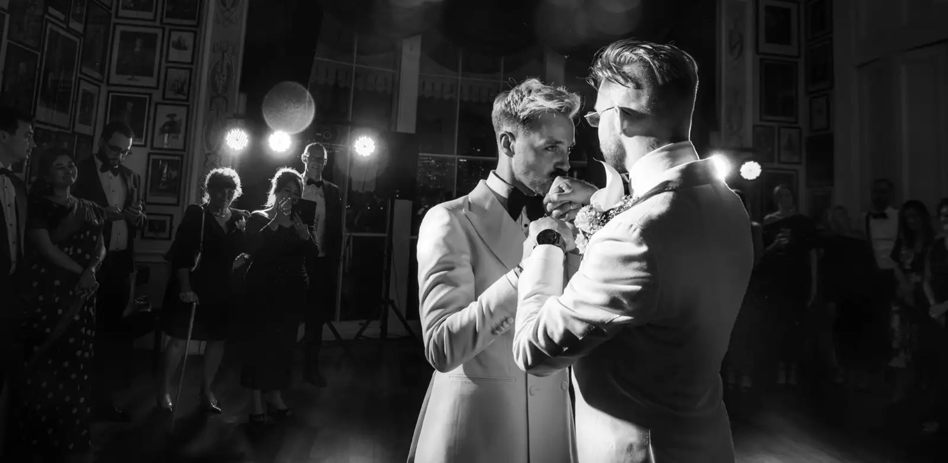 two grooms have their first dance