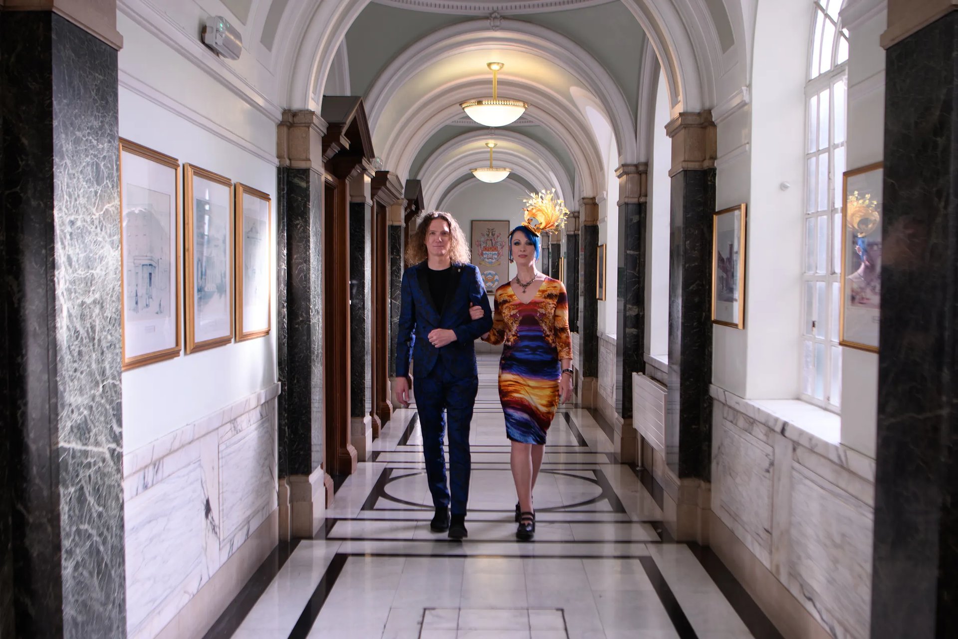 Wedding couple walking in hallway of Islington Town Hall
