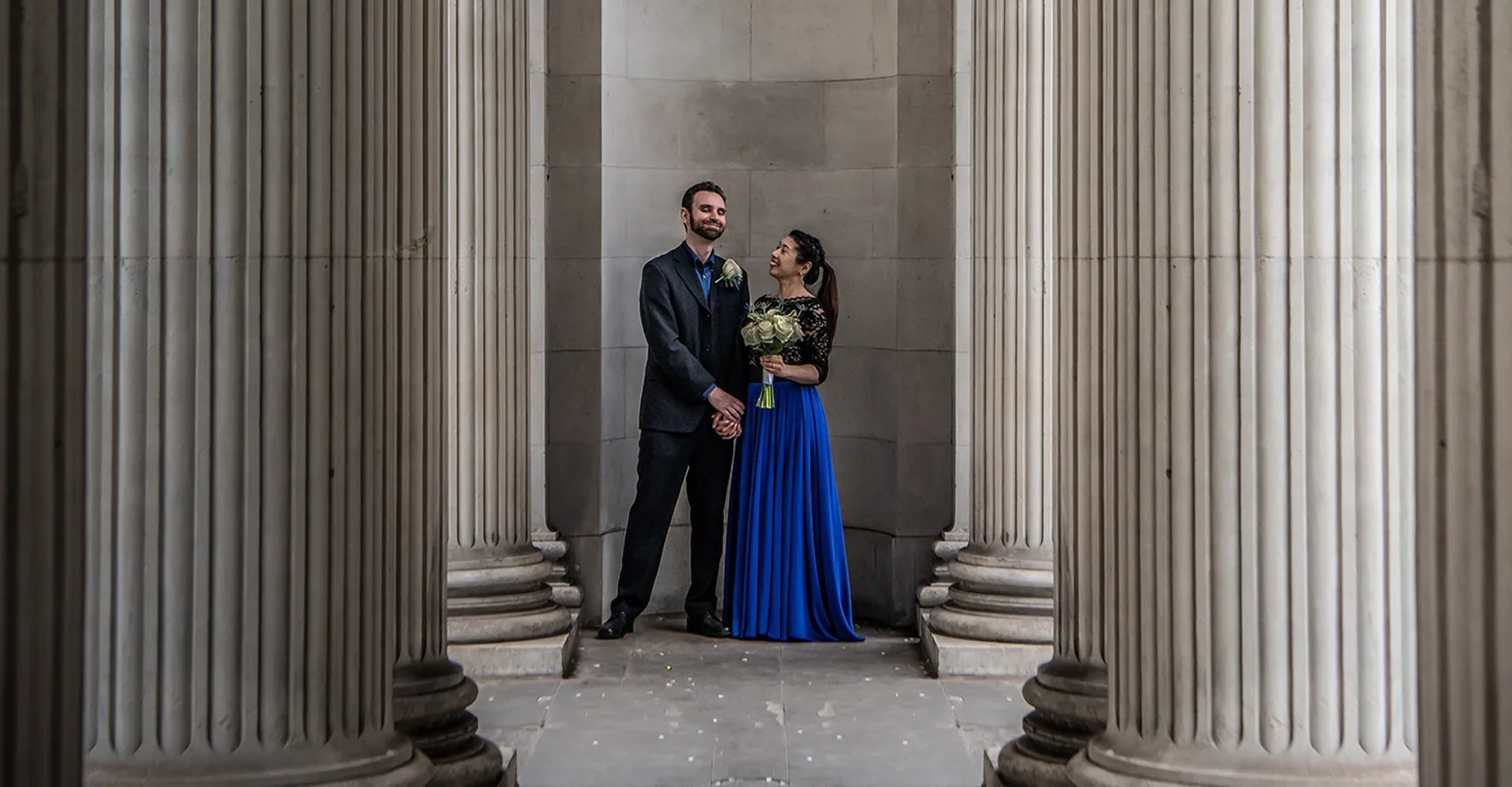 bride and groom standing outside Marylebone old town hall