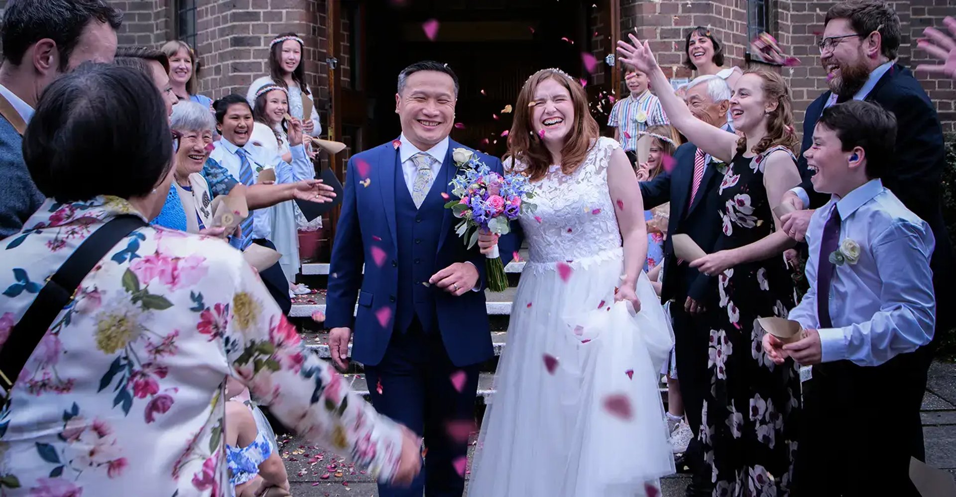 bride and groom having their confetti moment