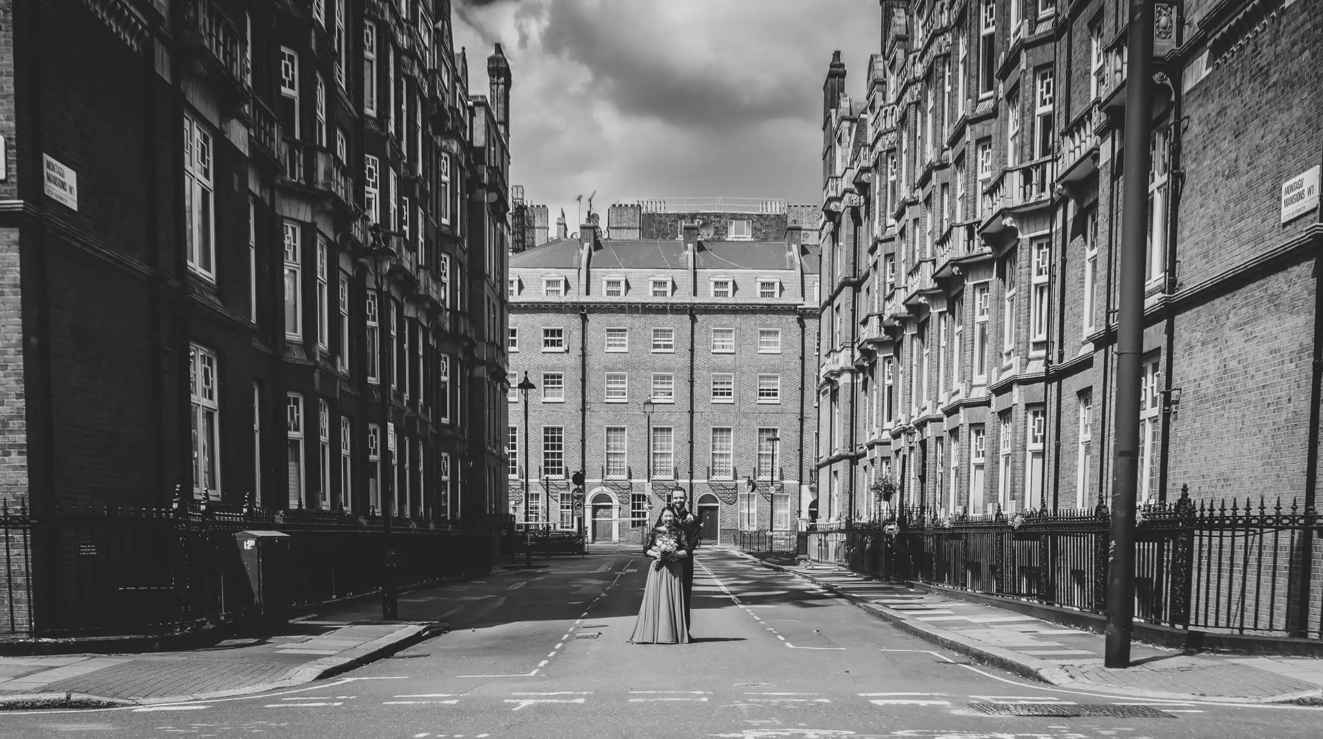 newly-weds stop for a photo on the streets of Marylebone