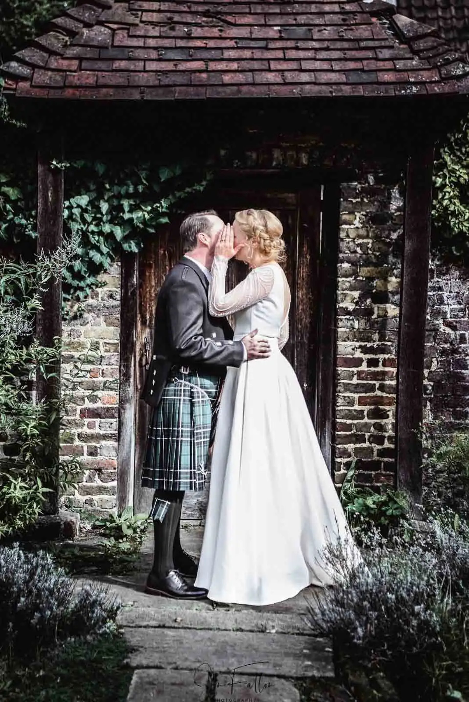 Isabella and Doug having a confetti moment outside Morden Park House