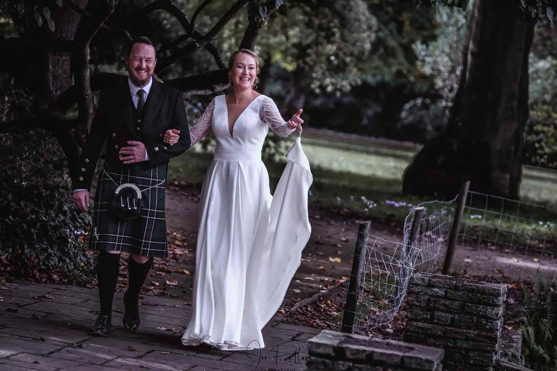 bride and groom walking around venue grounds
