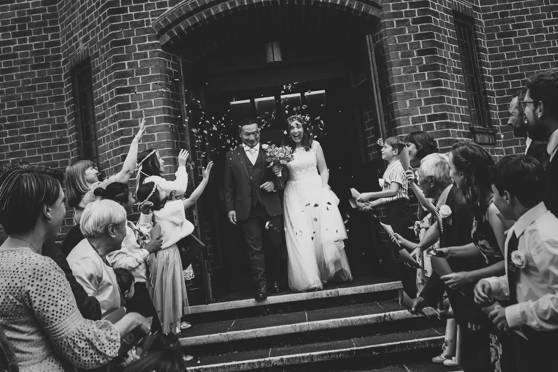 newly-weds being showered with confetti after their ceremony at Petts Wood Church