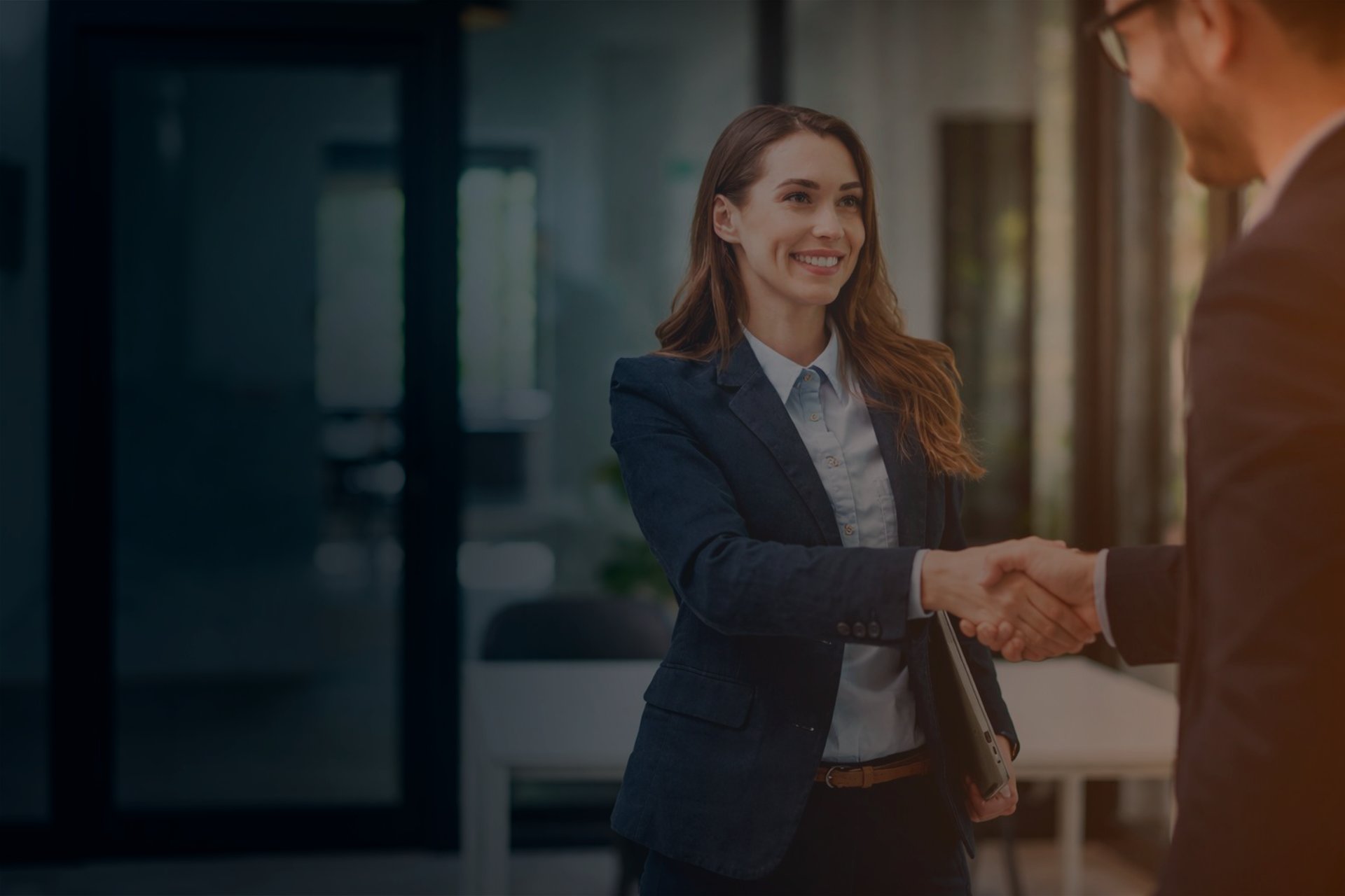 an abstract photo of a curved building with a blue sky in the background