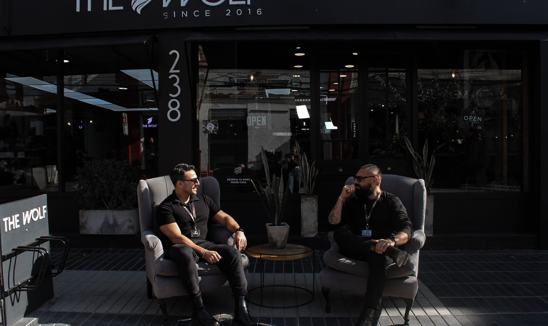 black and brown leather padded tub sofa