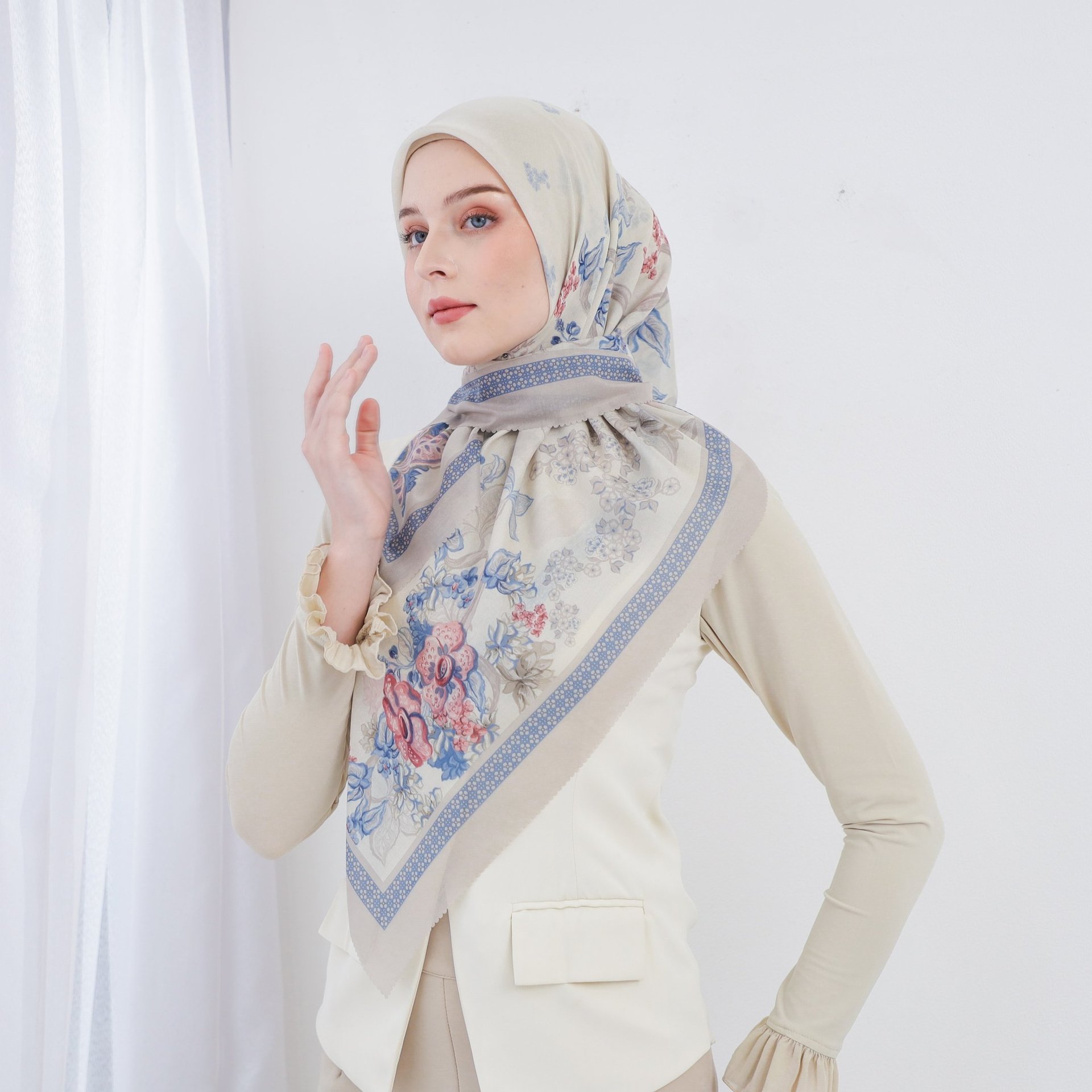 person wearing grey knit sweater