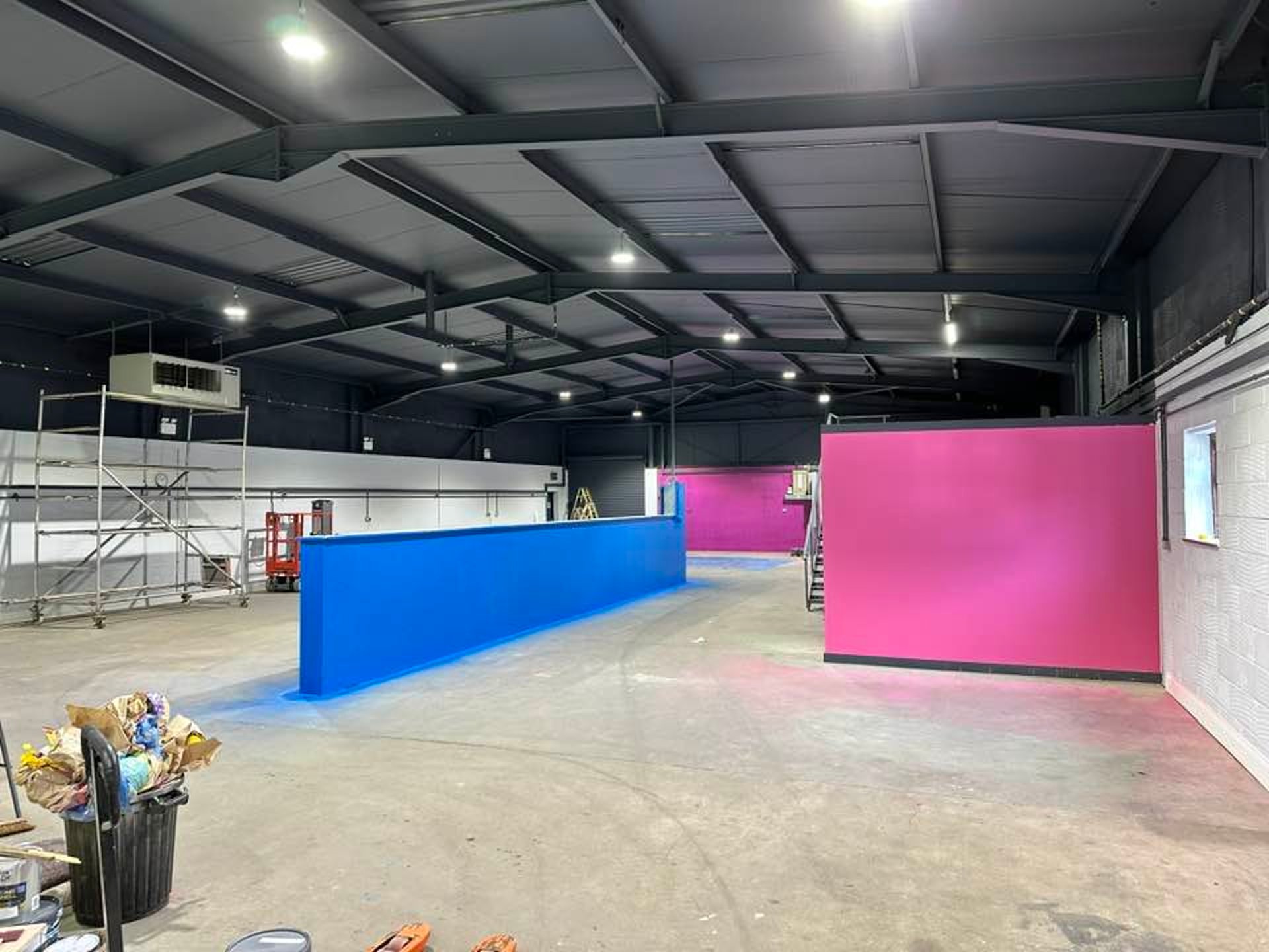 an abstract photo of a curved building with a blue sky in the background