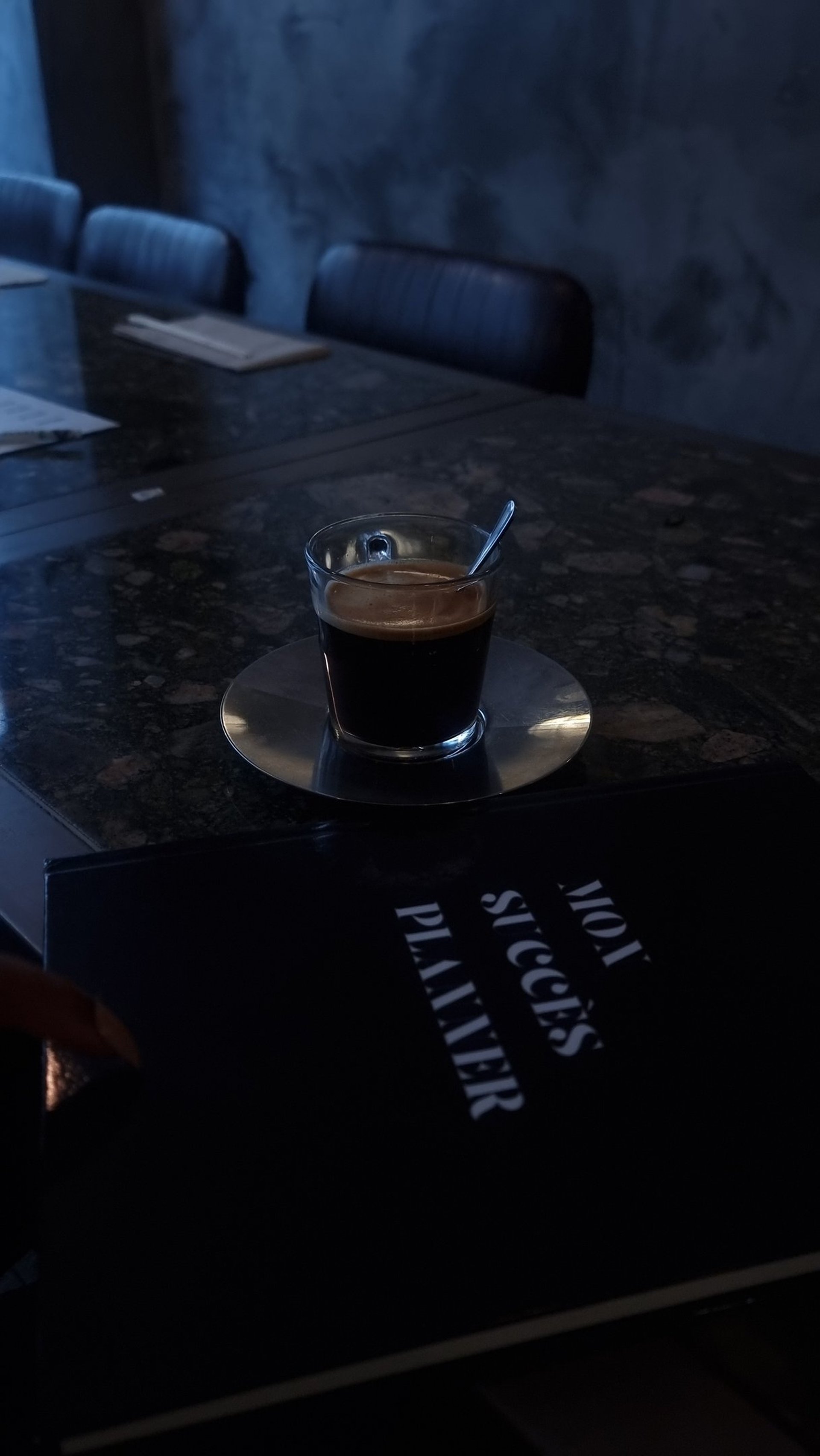 an abstract photo of a curved building with a blue sky in the background