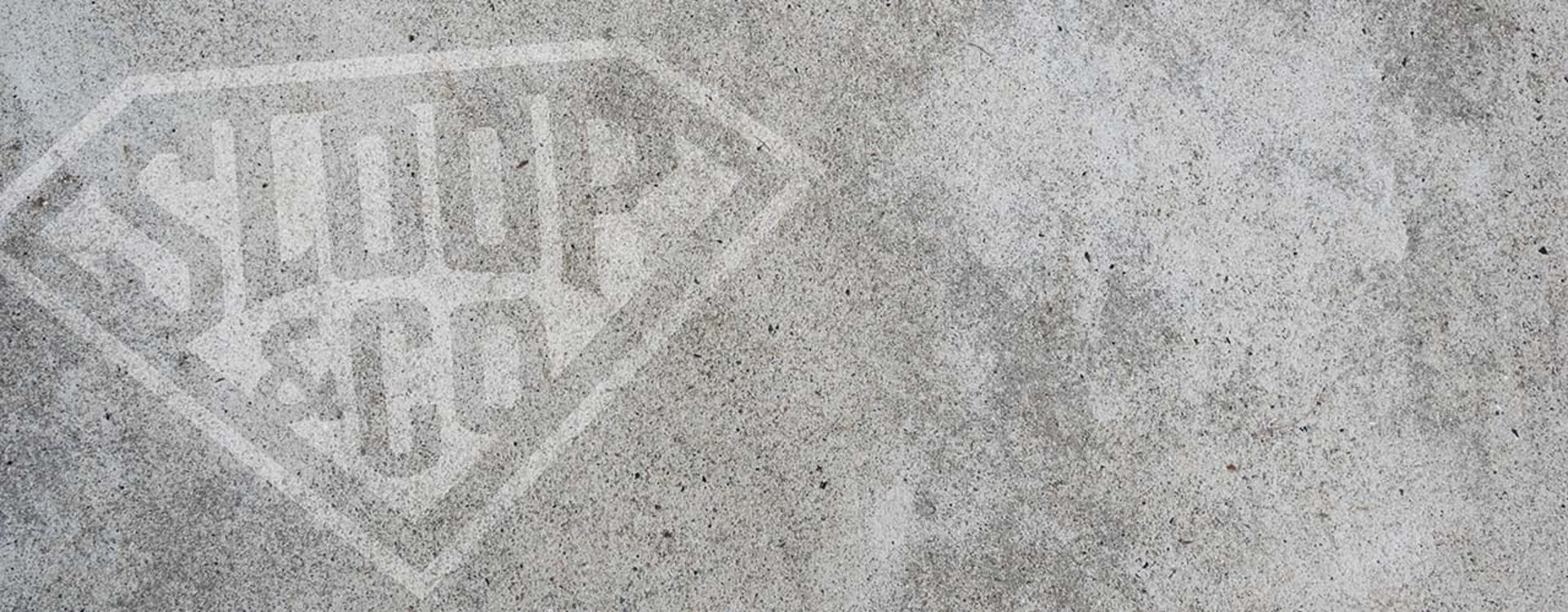 a black and white photo of a concrete wall