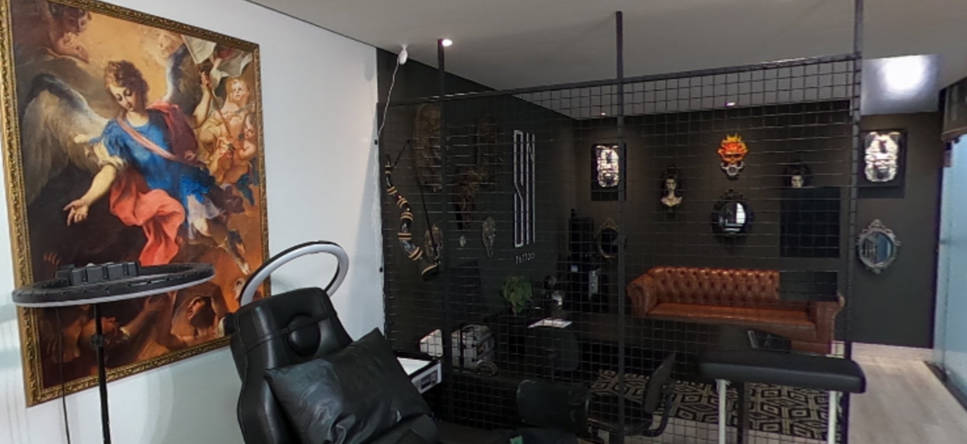 shallow focus photo of person tattooing person's right arm