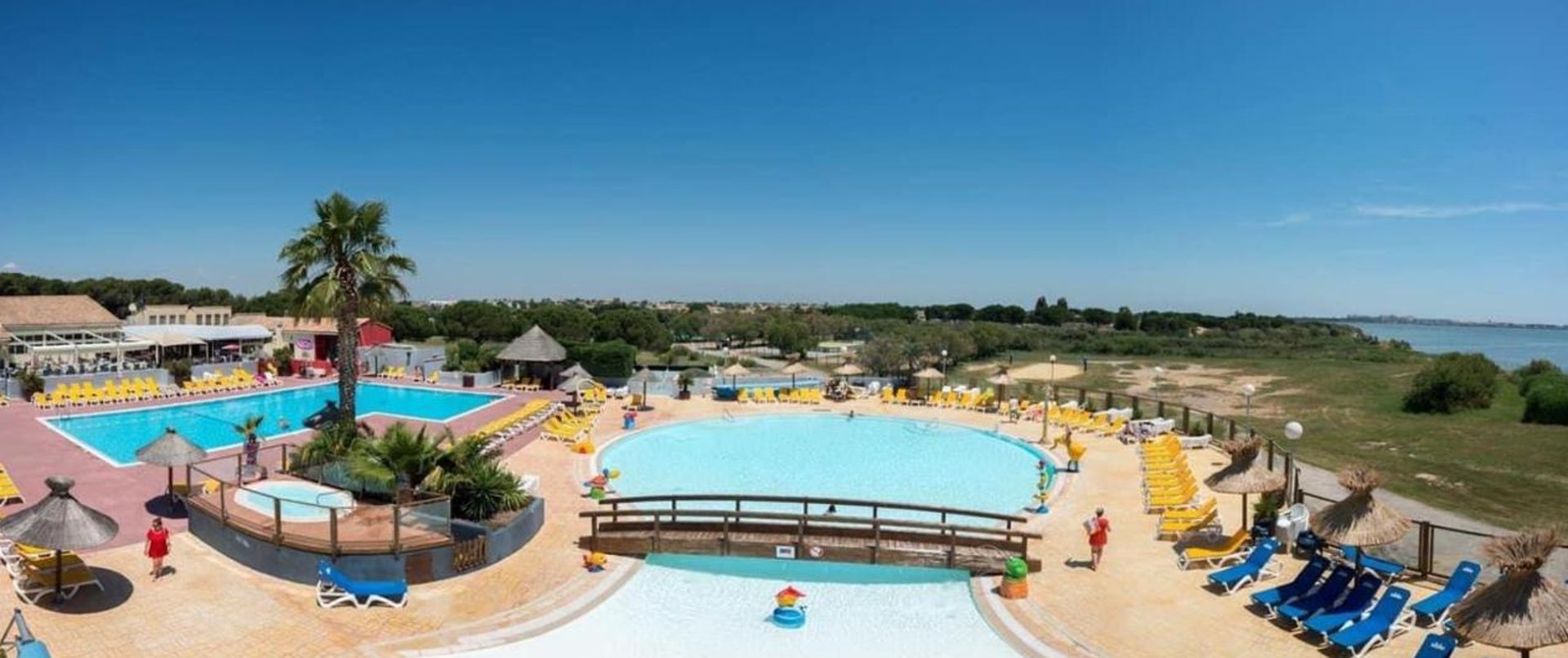 woman wearing yellow long-sleeved dress under white clouds and blue sky during daytime