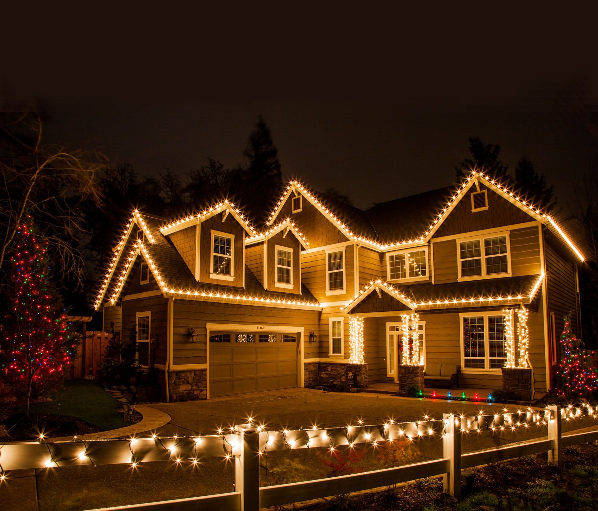 Warm white Christmas lights installed on a West Michigan home